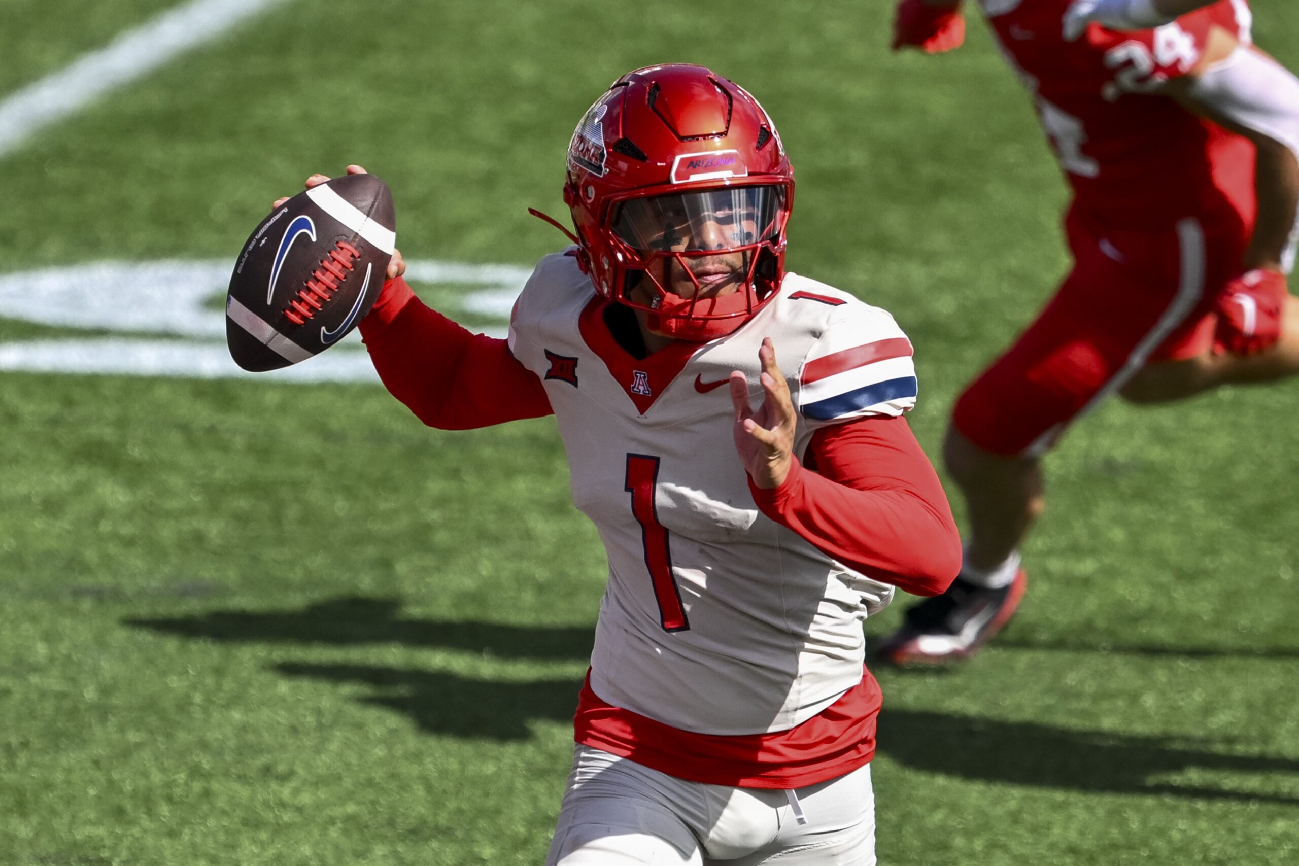 Oct 18, 2025; Houston, Texas, USA; Arizona Wildcats quarterback Noah Fifita (1) throws the ball during the first quarter against the Houston Cougars at TDECU Stadium. Mandatory Credit: Maria Lysaker-Imagn Images