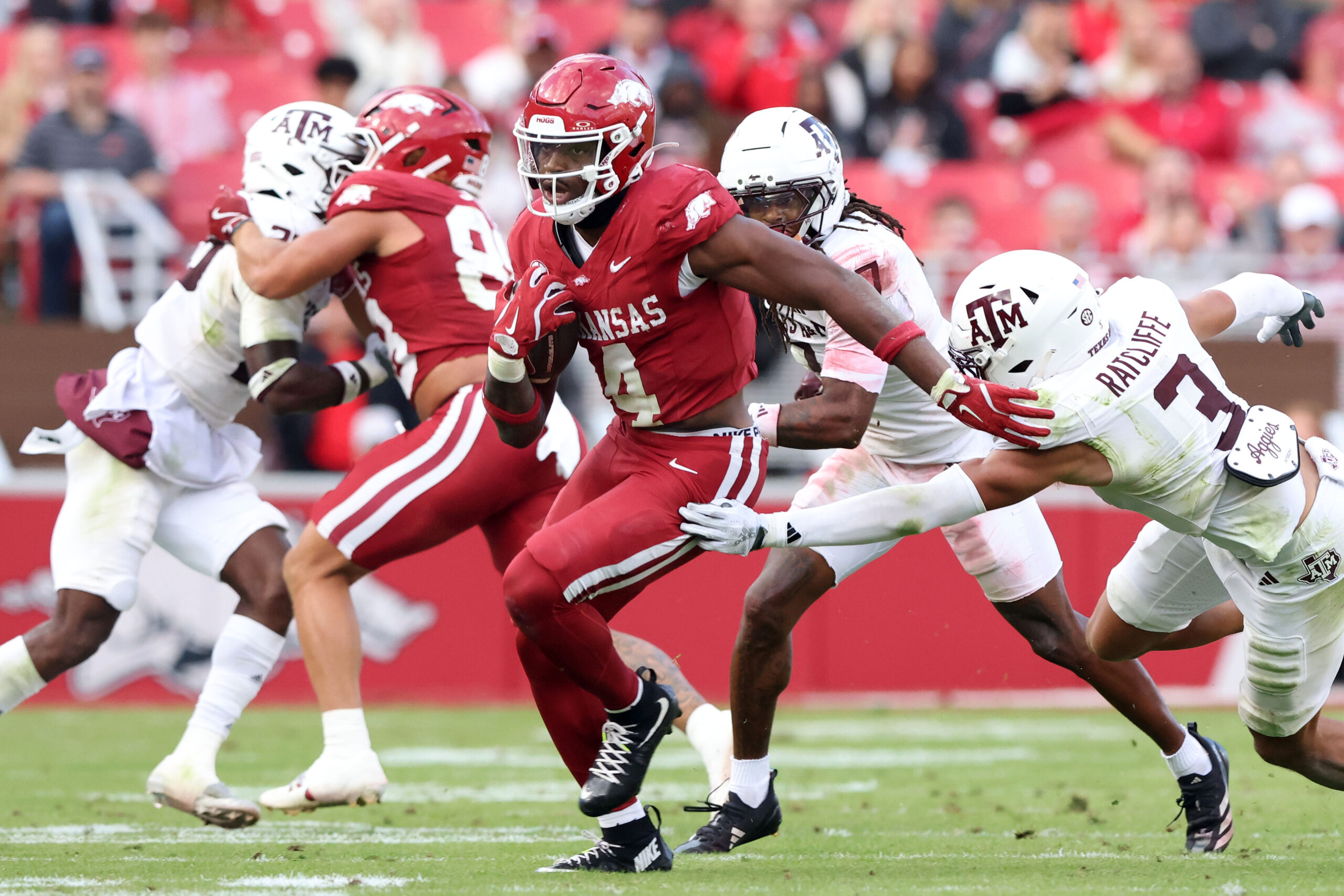 Oct 18, 2025; Fayetteville, Arkansas, USA; Arkansas Razorbacks running back Mike Washington Jr (4) rushes in the second quarter against the Texas A&M Aggies at Donald W. Reynolds Razorback Stadium. Mandatory Credit: Nelson Chenault-Imagn Images