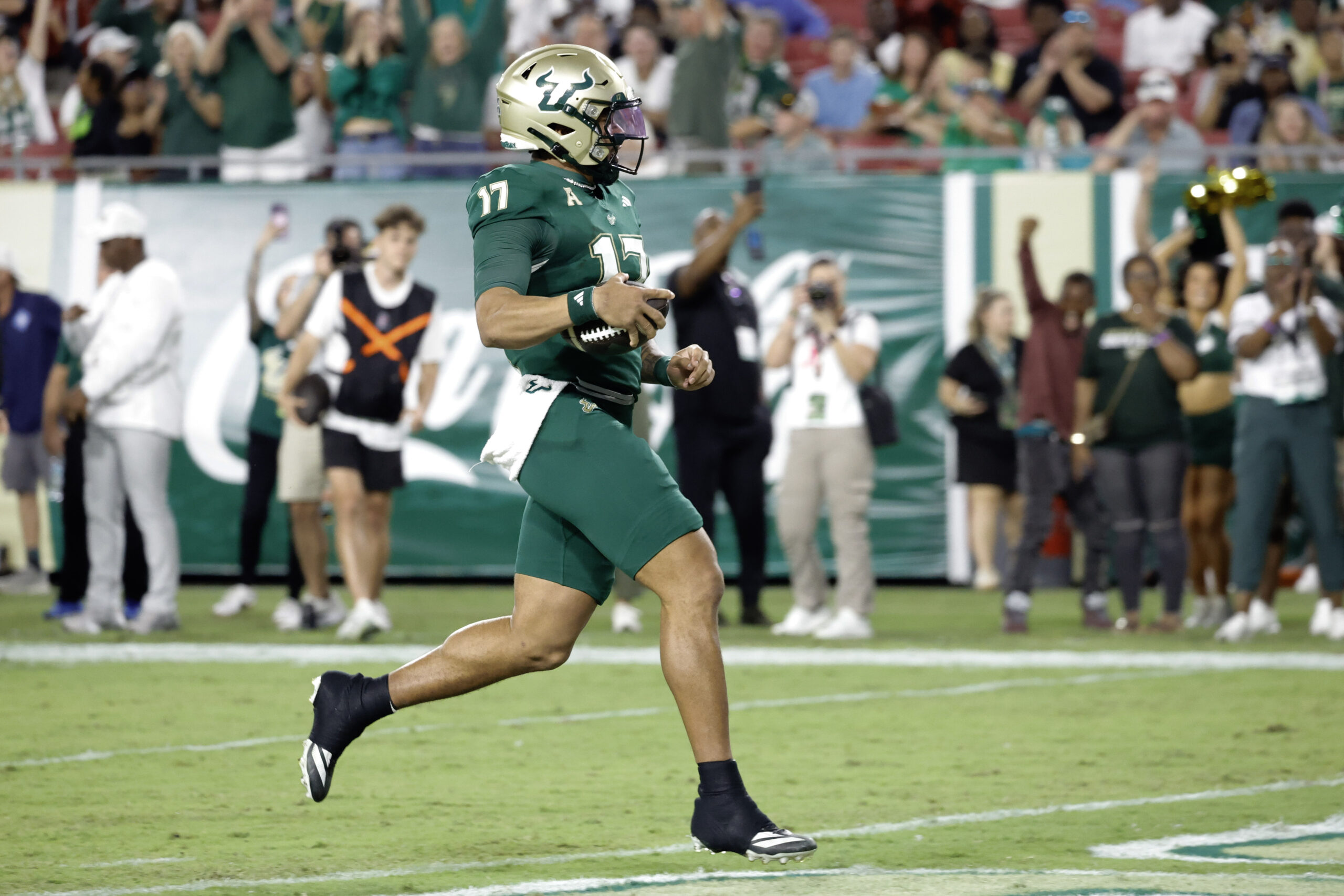 Oct 18, 2025; Tampa, Florida, USA;  South Florida Bulls quarterback Byrum Brown (17) runs for a touchdown during the first quarter against the Florida Atlantic Owls at Raymond James Stadium. Mandatory Credit: Reinhold Matay-Imagn Images
