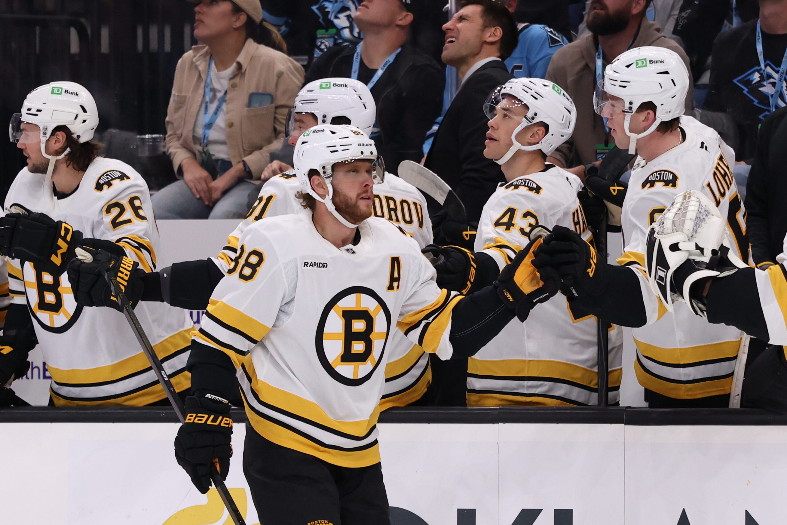 Oct 19, 2025; Salt Lake City, Utah, USA; Boston Bruins right wing David Pastrnak (88) scores a goal against the Utah Mammoth and celebrates with teammates during the first period at Delta Center. Mandatory Credit: Rob Gray-Imagn Images