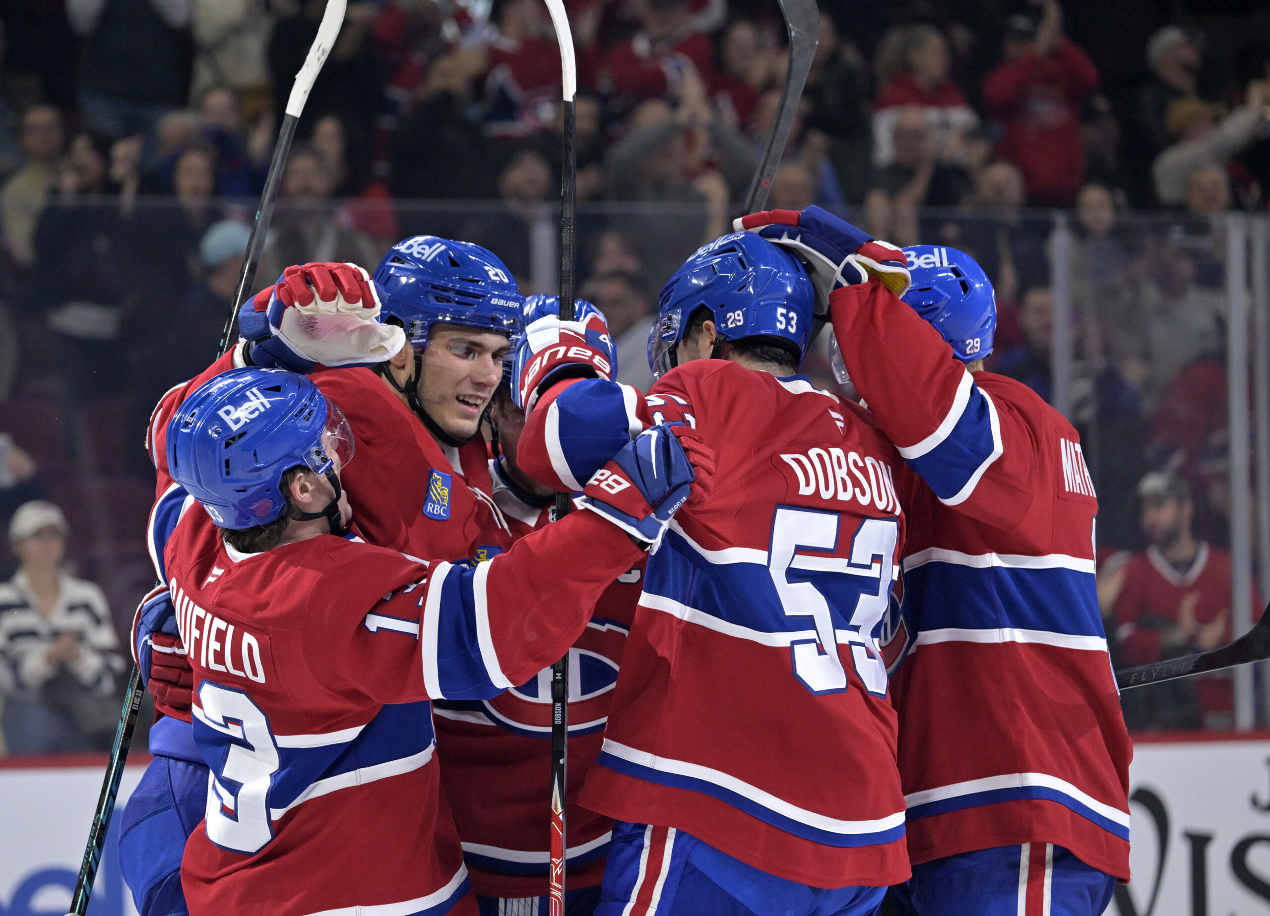 Oct 20, 2025; Montreal, Quebec, CAN; Montreal Canadiens forward Juraj Slafkovsky (20) celebrates with teammates after scoring a goal against the Buffalo Sabres during the third period at the Bell Centre. Mandatory Credit: Eric Bolte-Imagn Images
