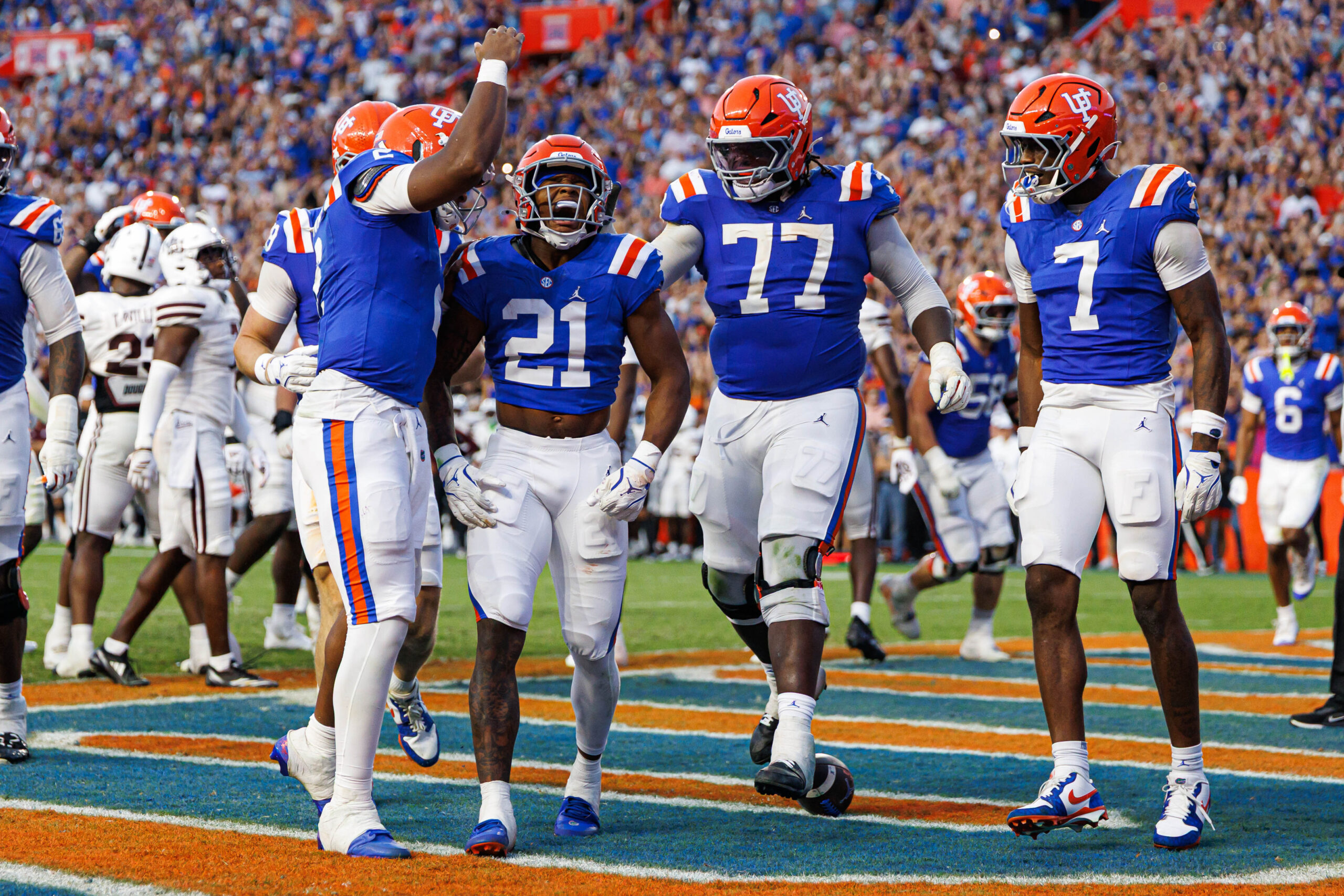 Oct 18, 2025; Gainesville, Florida, USA; Florida Gators running back KD Daniels (21) celebrates with Florida Gators quarterback DJ Lagway (2) after scoring a touchdown against the Mississippi State Bulldogs during the second half at Ben Hill Griffin Stadium. Mandatory Credit: Matt Pendleton-Imagn Images