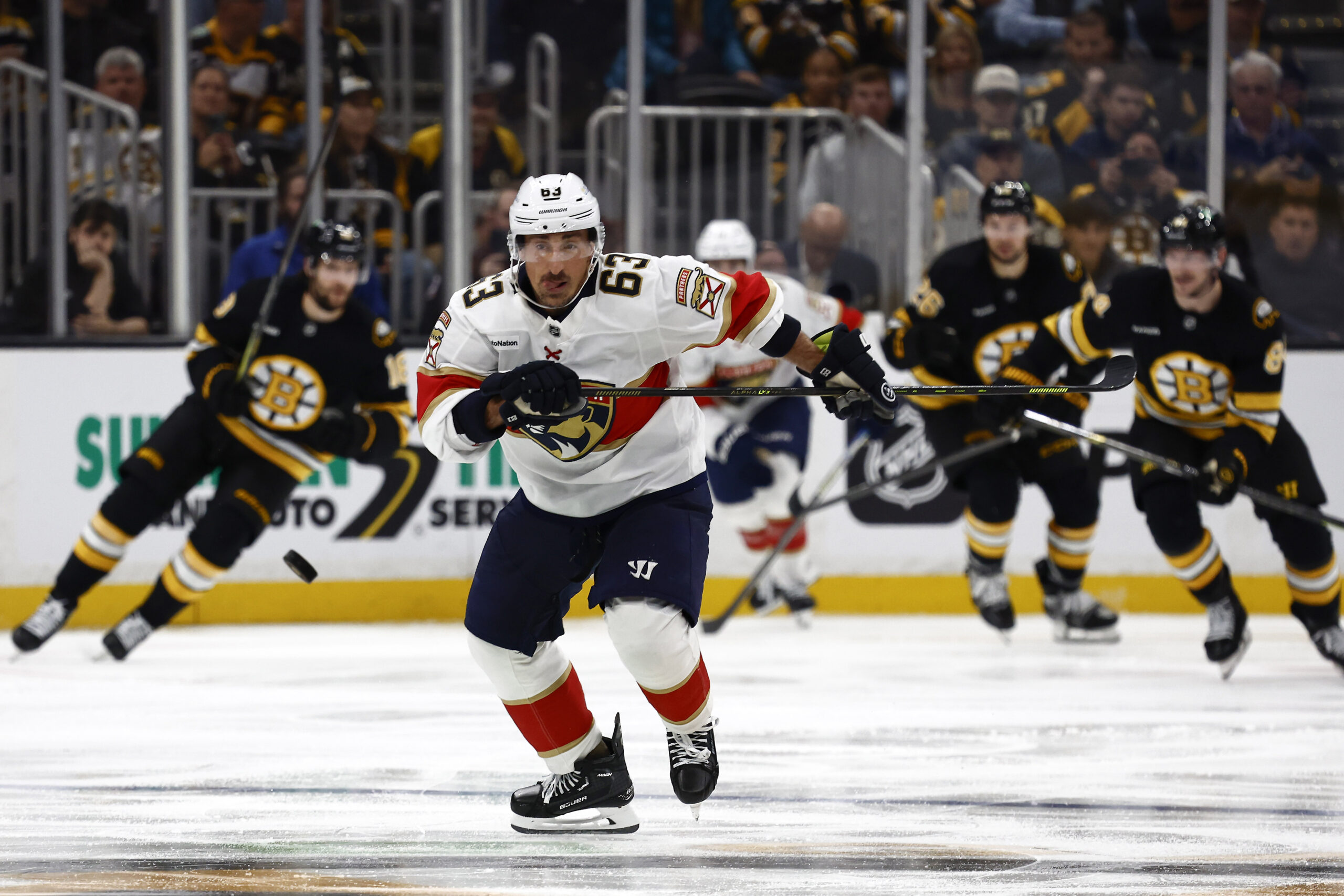 Oct 21, 2025; Boston, Massachusetts, USA; Florida Panthers left wing Brad Marchand (63) chases a loose puck against the Boston Bruins during the third period at TD Garden. Mandatory Credit: Winslow Townson-Imagn Images