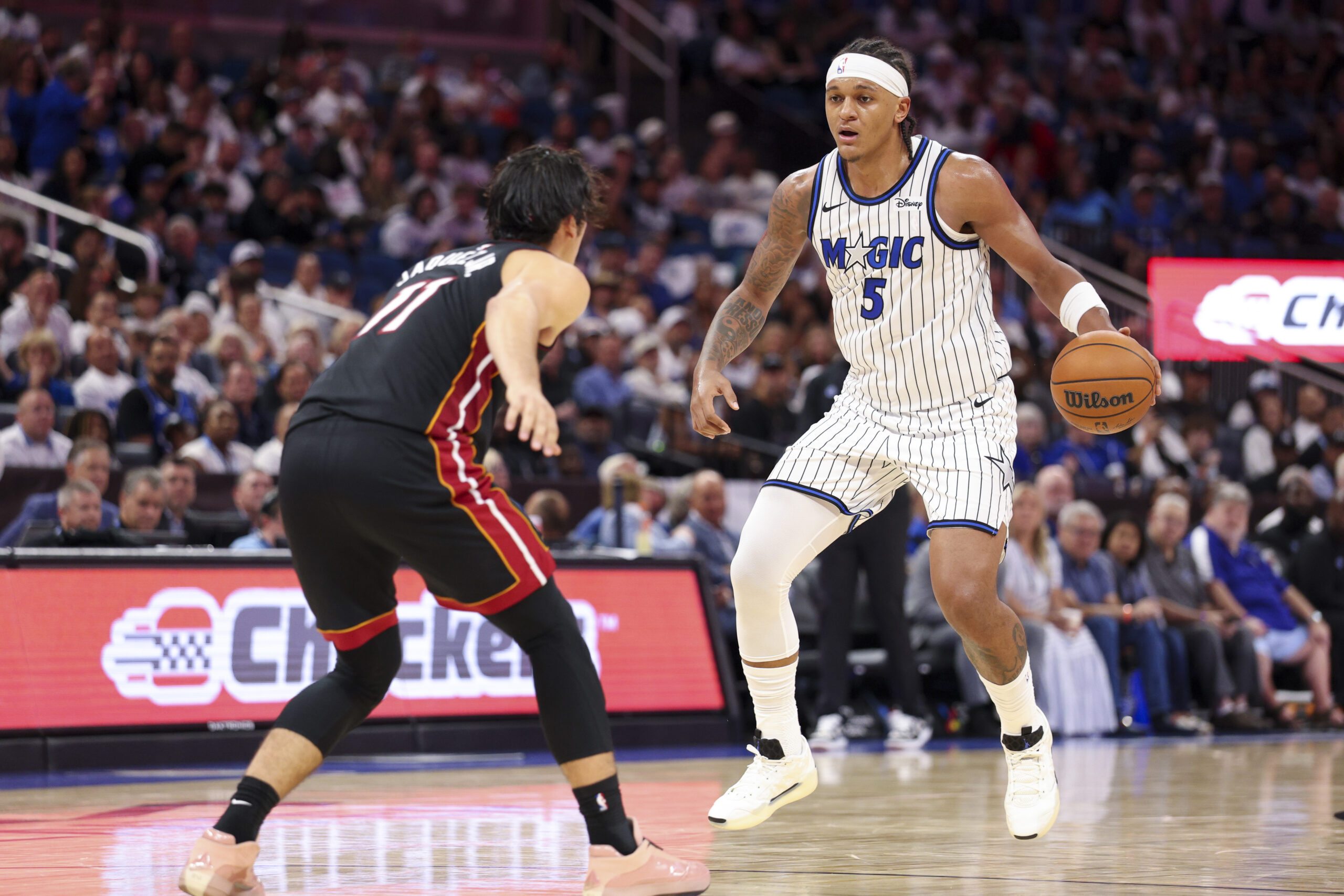 Oct 22, 2025; Orlando, Florida, USA; Orlando Magic forward Paolo Banchero (5) controls the ball against the Miami Heat in the third quarter at Kia Center. Mandatory Credit: Nathan Ray Seebeck-Imagn Images