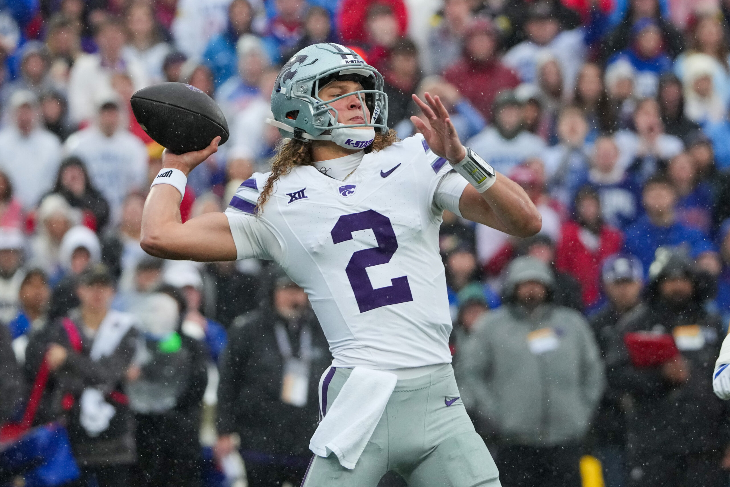 Oct 25, 2025; Lawrence, Kansas, USA; Kansas State Wildcats quarterback Avery Johnson (2) throws a pass against the Kansas Jayhawks during the first half of the game at David Booth Kansas Memorial Stadium. Mandatory Credit: Denny Medley-Imagn Images