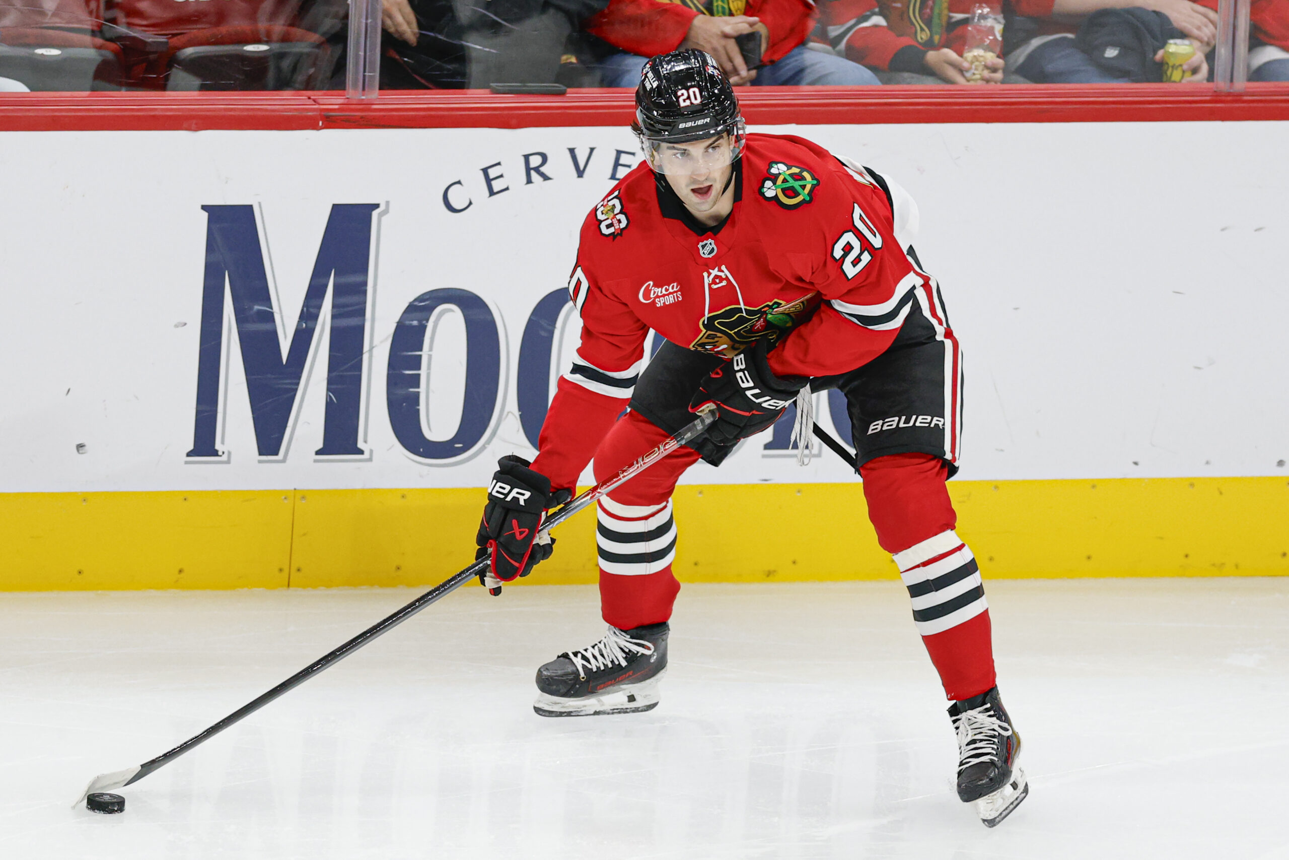 Oct 26, 2025; Chicago, Illinois, USA; Chicago Blackhawks center Ryan Greene (20) looks to pass the puck against the Los Angeles Kings during the second period at United Center. Mandatory Credit: Kamil Krzaczynski-Imagn Images