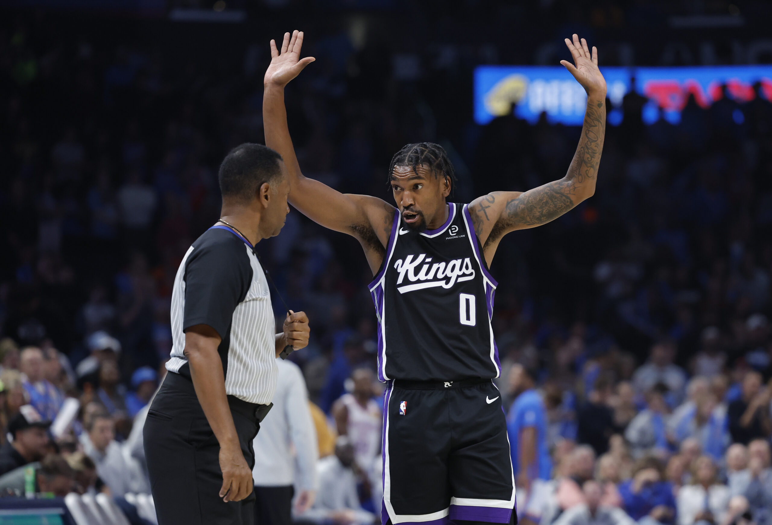 Oct 28, 2025; Oklahoma City, Oklahoma, USA; Sacramento Kings guard Malik Monk (0) reacts to an officials call after a play against the Oklahoma City Thunder during the second half at Paycom Center. Mandatory Credit: Alonzo Adams-Imagn Images