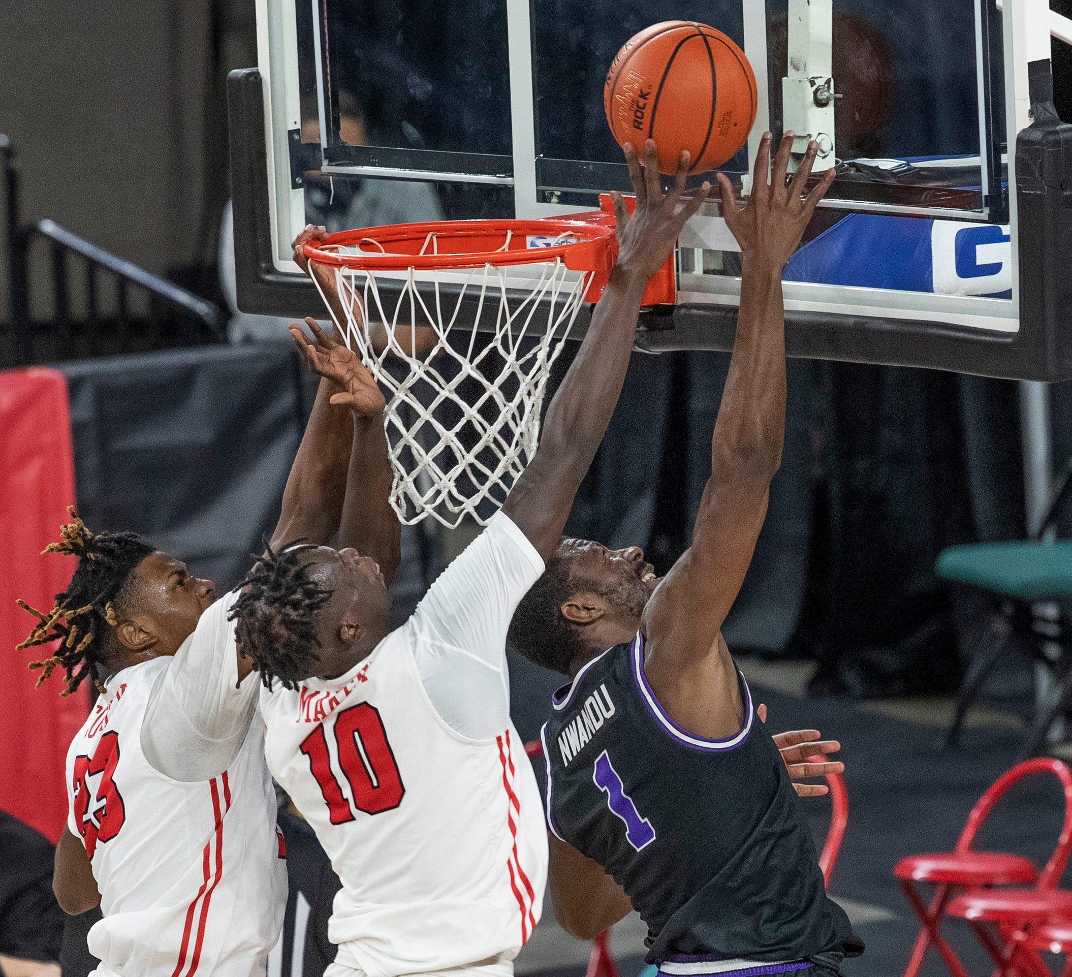 Marist Javon Cooley and Henry Makeny  try to block shot by Niagara Kobi Nwandu during first half action. Marist vs Niagara in MAAC men's basketball tournament quarterfinal game in Atlantic City on March 11, 2021.

Maacmarist210311c
