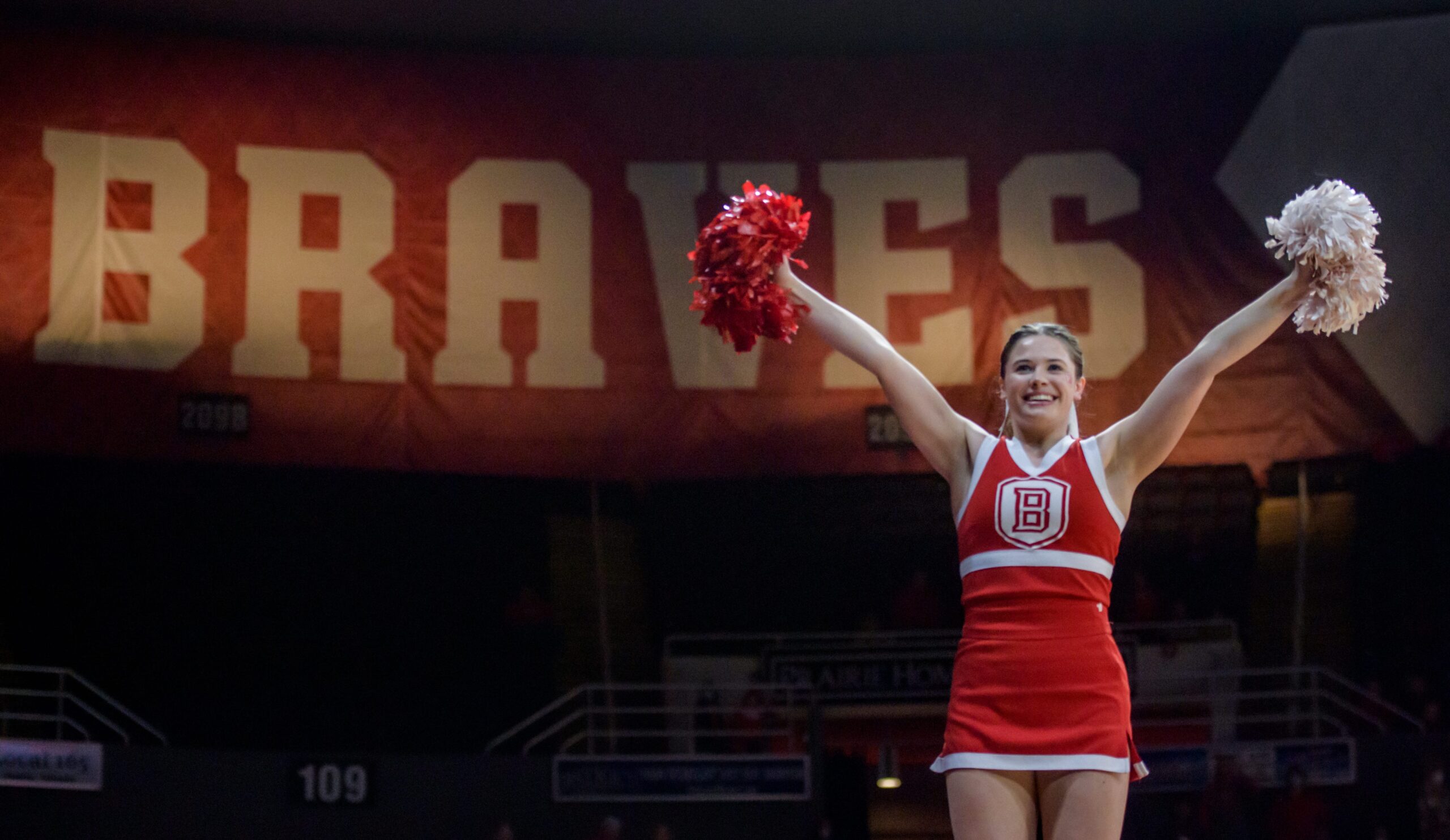 A Bradley Braves cheerleader raises her pompoms before the start of a game against Evansville on Wednesday, Jan. 12, 2022 at Carver Arena. The Braves defeated the Purple Aces 79-47.