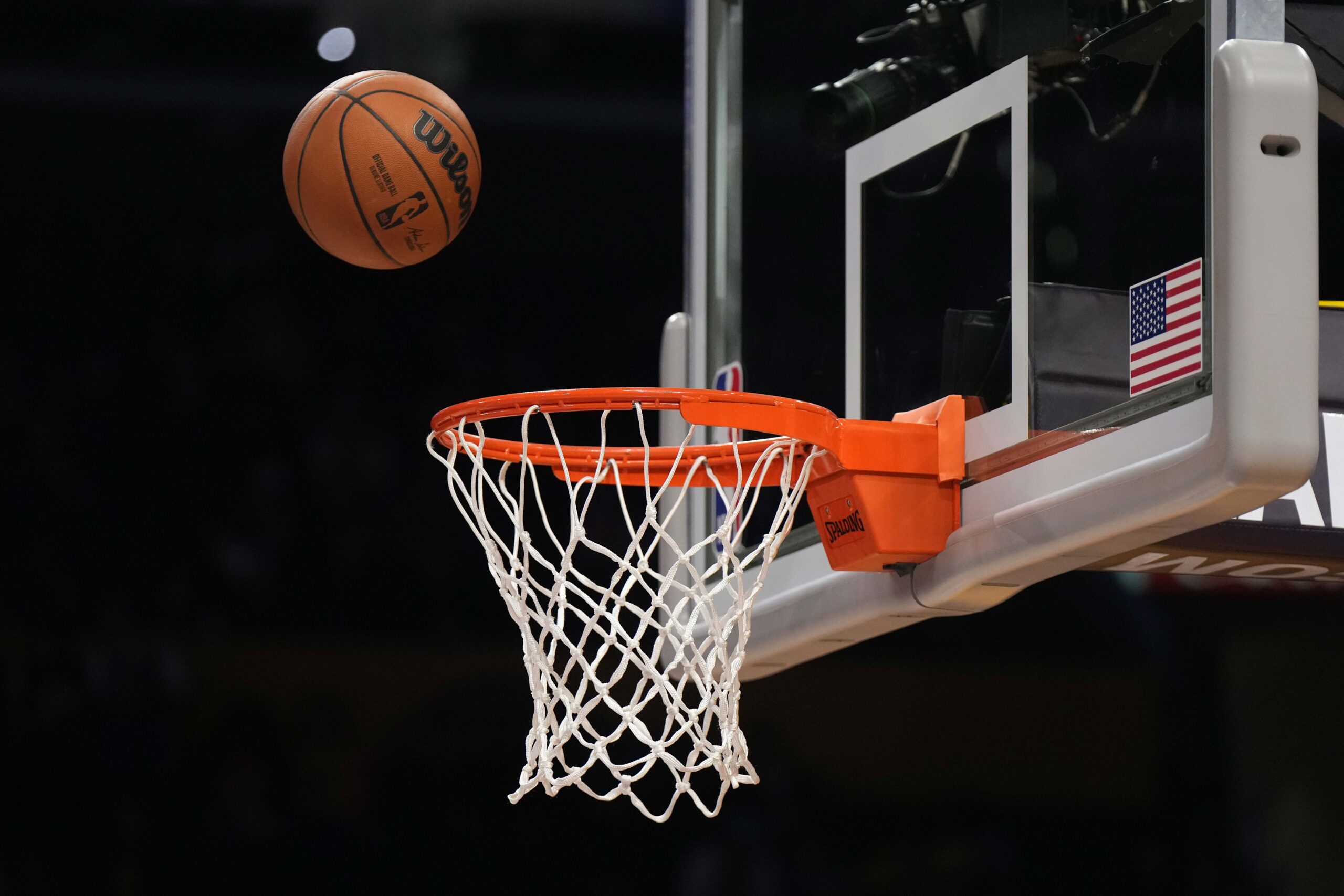Feb 23, 2023; Los Angeles, California, USA; A Wilson official NBA basketball swishes through the net at Crypto.com Arena. Mandatory Credit: Kirby Lee-Imagn Images