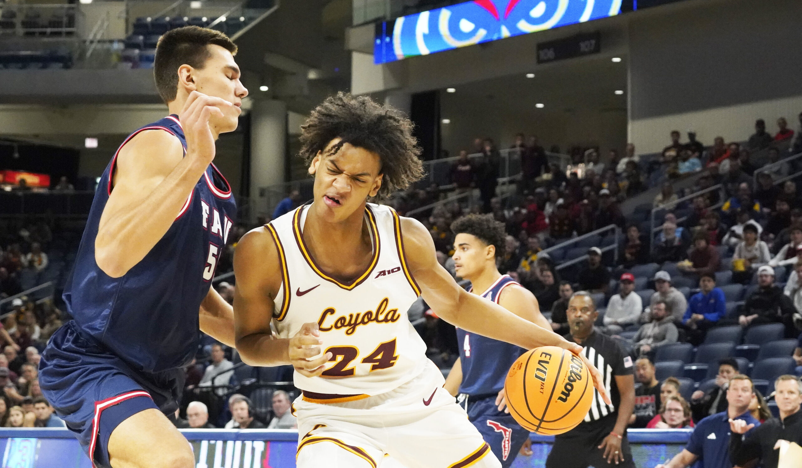Nov 8, 2023; Chicago, Illinois, USA; Florida Atlantic Owls center Vladislav Goldin (50) defends Loyola Ramblers center Miles Rubin (24) during the first half at Wintrust Arena. Mandatory Credit: David Banks-Imagn Images