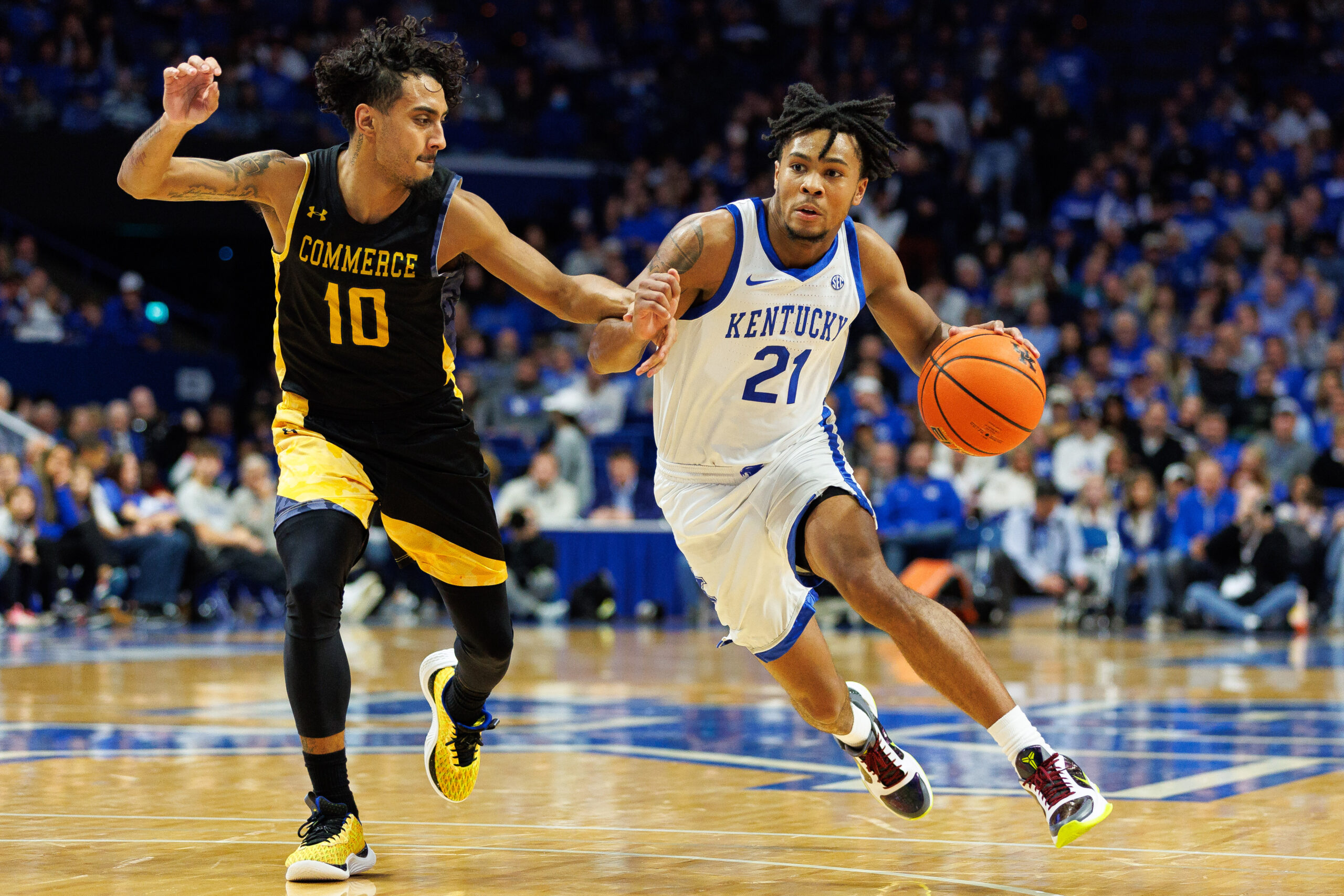 Nov 10, 2023; Lexington, Kentucky, USA; Kentucky Wildcats guard D.J. Wagner (21) drives to the basket against Texas A&M Commerce Lions guard Alonzo Dodd (10) during the second half at Rupp Arena at Central Bank Center. Mandatory Credit: Jordan Prather-Imagn Images