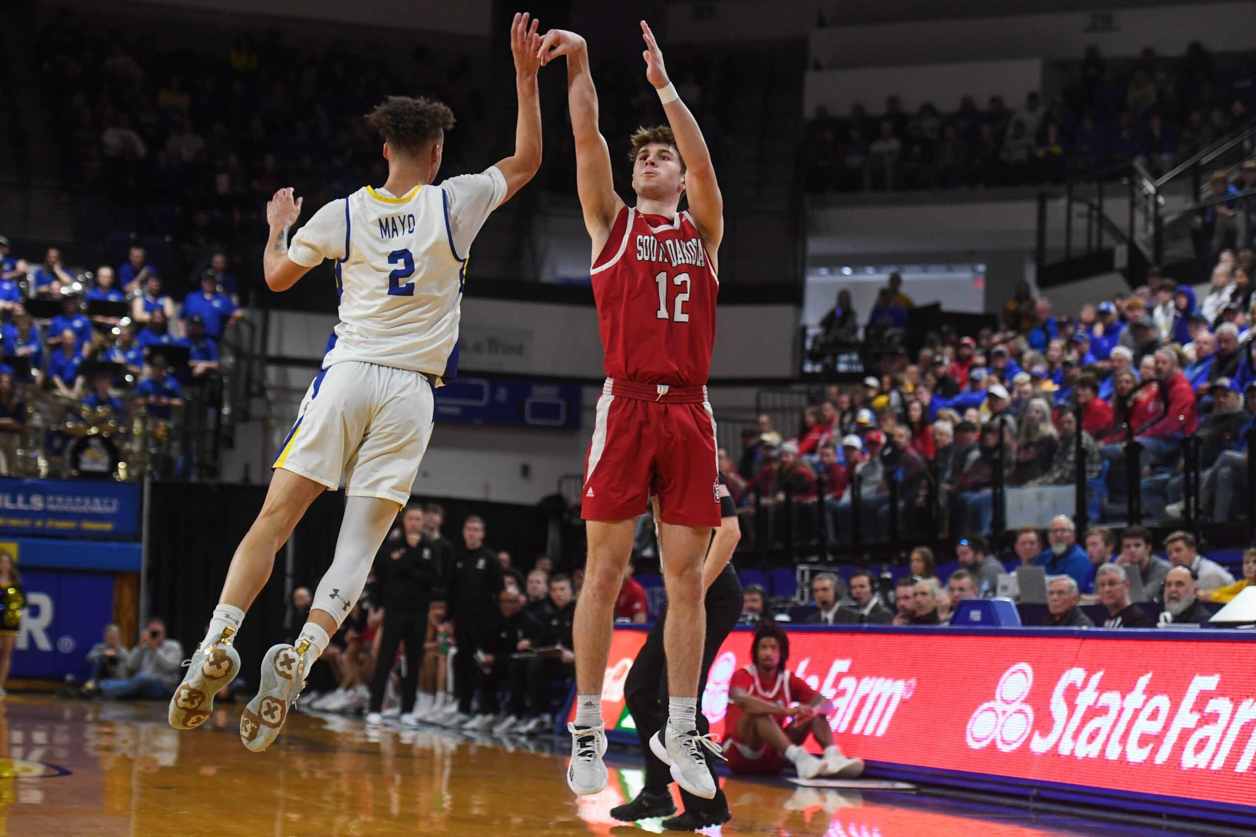 USD guard Isaac Bruns (12) shoots the ball on Sunday, Feb. 4, 2024 at Frost Arena in Brookings.