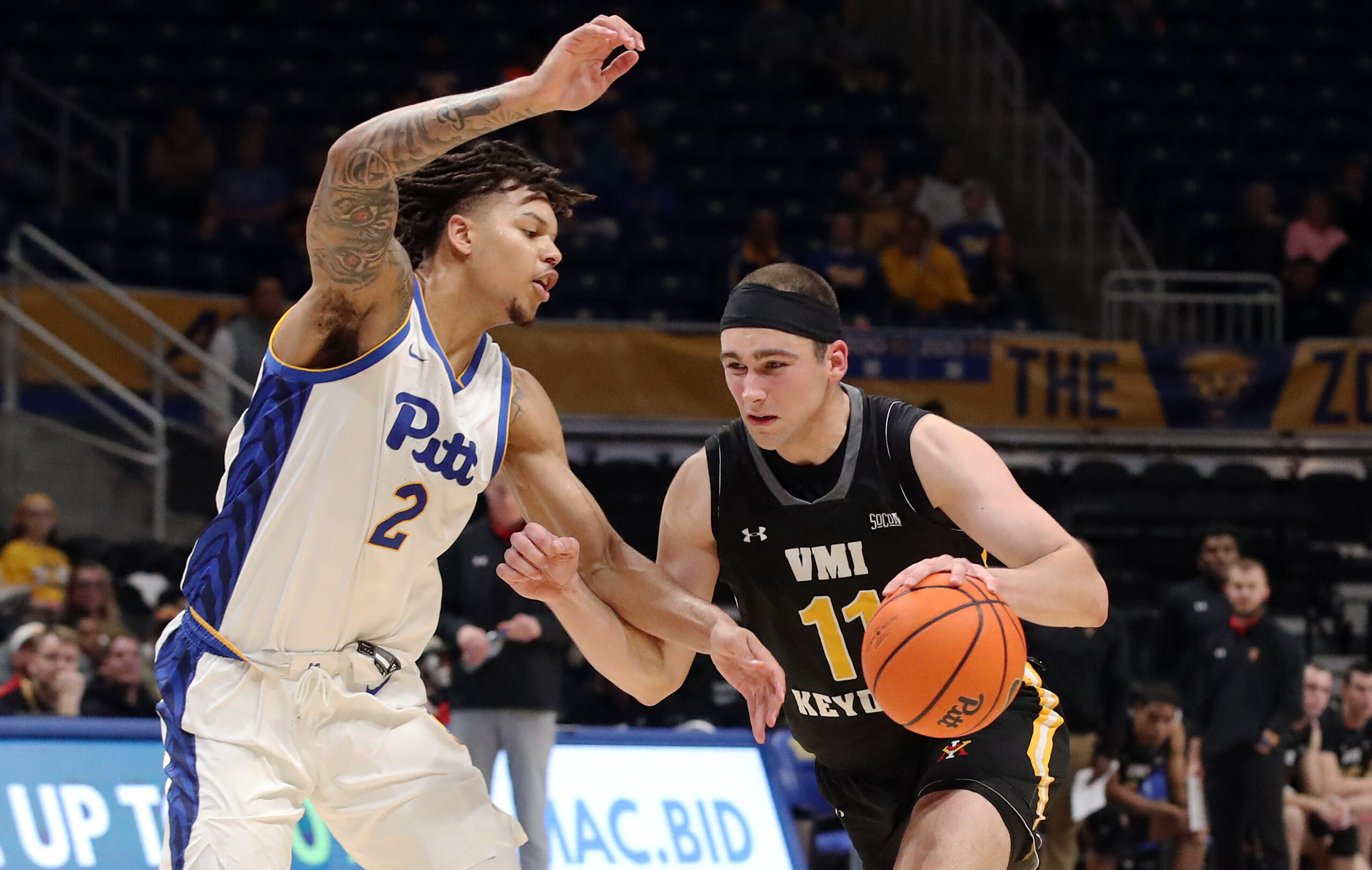 Nov 18, 2024; Pittsburgh, Pennsylvania, USA;  Virginia Military Keydets forward Augustinas Kiudulas (11) goes to the basket against Pittsburgh Panthers forward Cameron Corhen (2) during the first half at the Petersen Events Center. Mandatory Credit: Charles LeClaire-Imagn Images