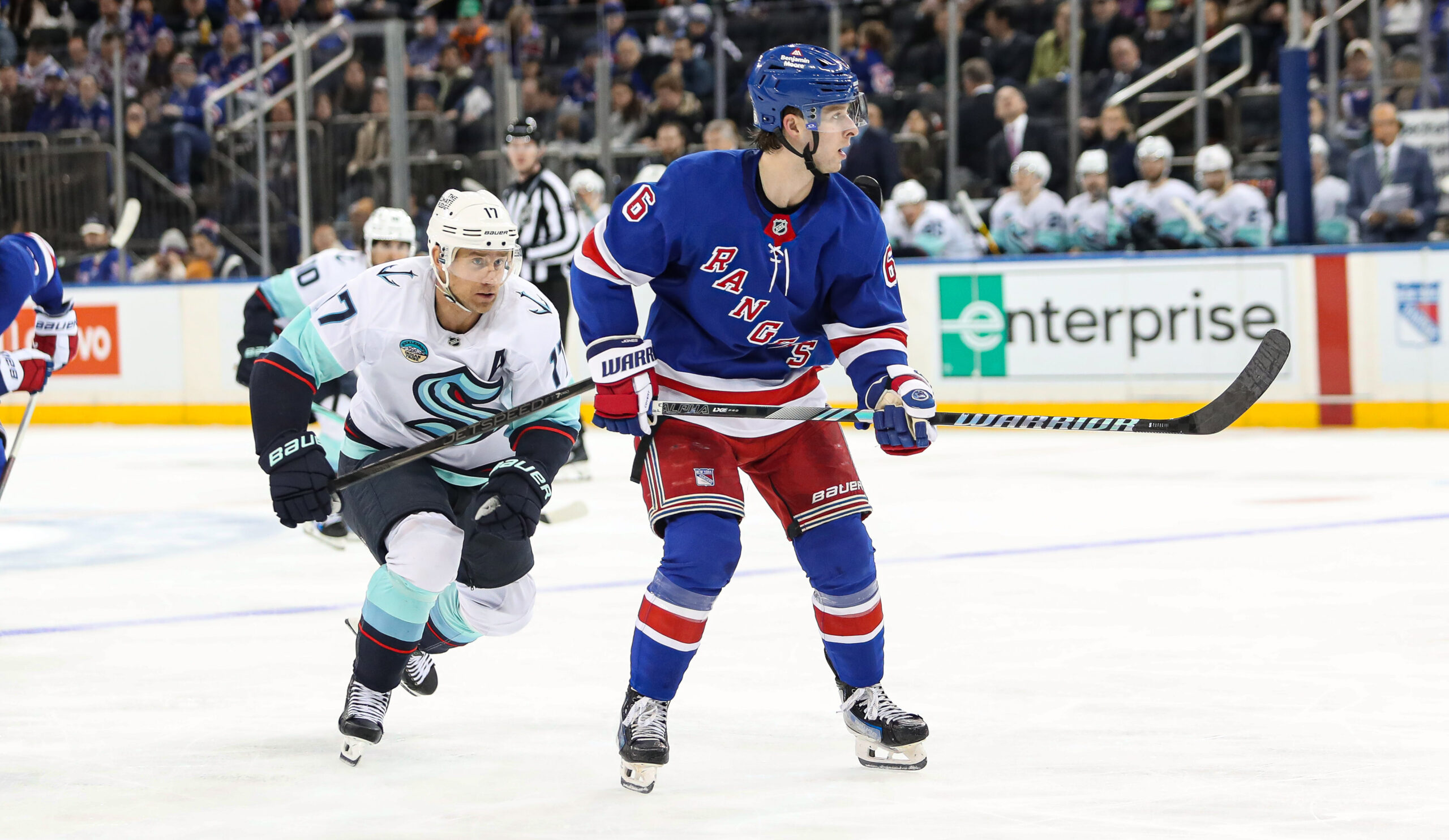 Dec 8, 2024; New York, New York, USA; Seattle Kraken left wing Jaden Schwartz (17) chases after New York Rangers defenseman Zac Jones (6) during the third period at Madison Square Garden. Mandatory Credit: Danny Wild-Imagn Images