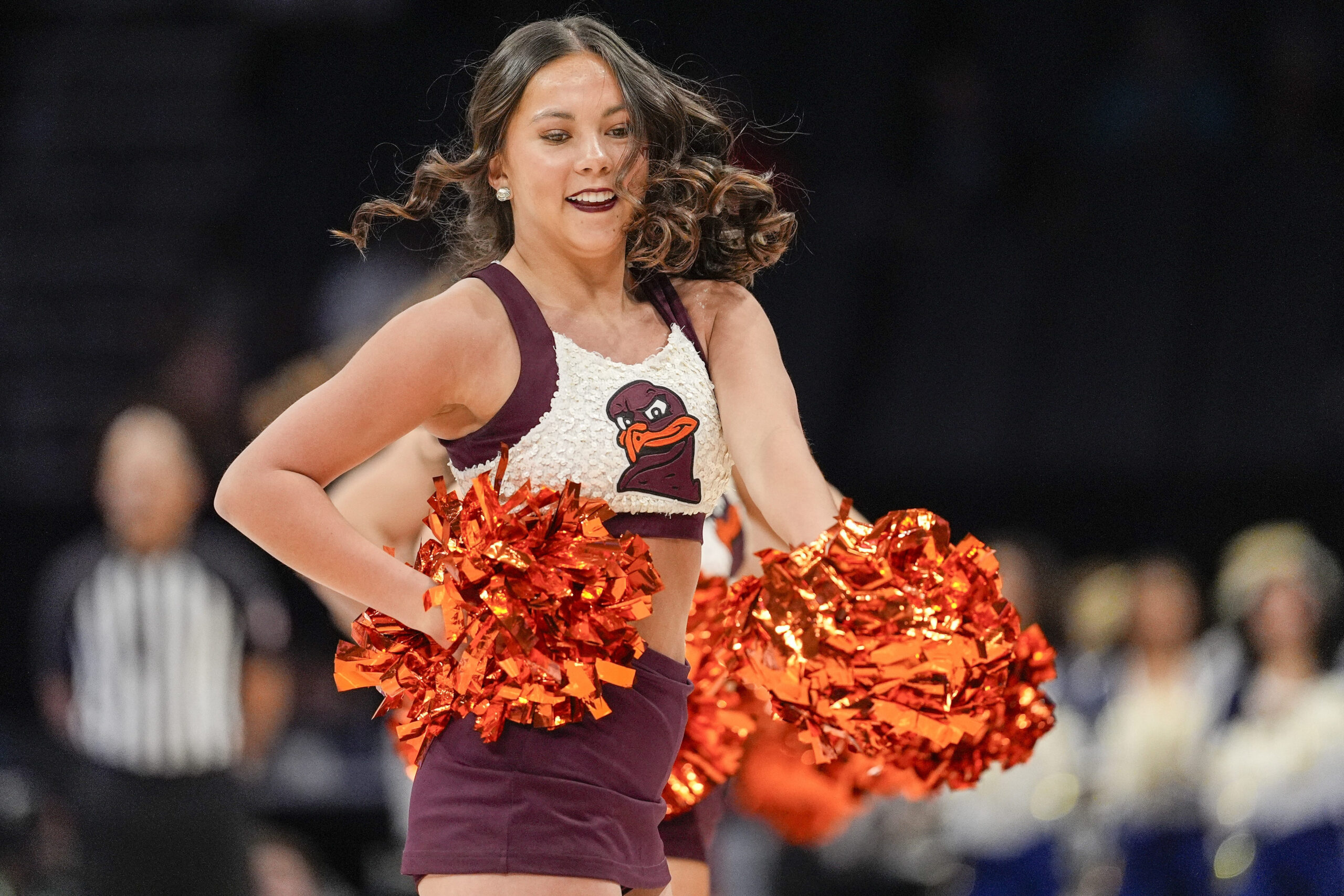 Mar 11, 2025; Charlotte, NC, USA; Virginia Tech Hokies cheerleaders during the first half against the California Golden Bears at Spectrum Center. Mandatory Credit: Jim Dedmon-Imagn Images