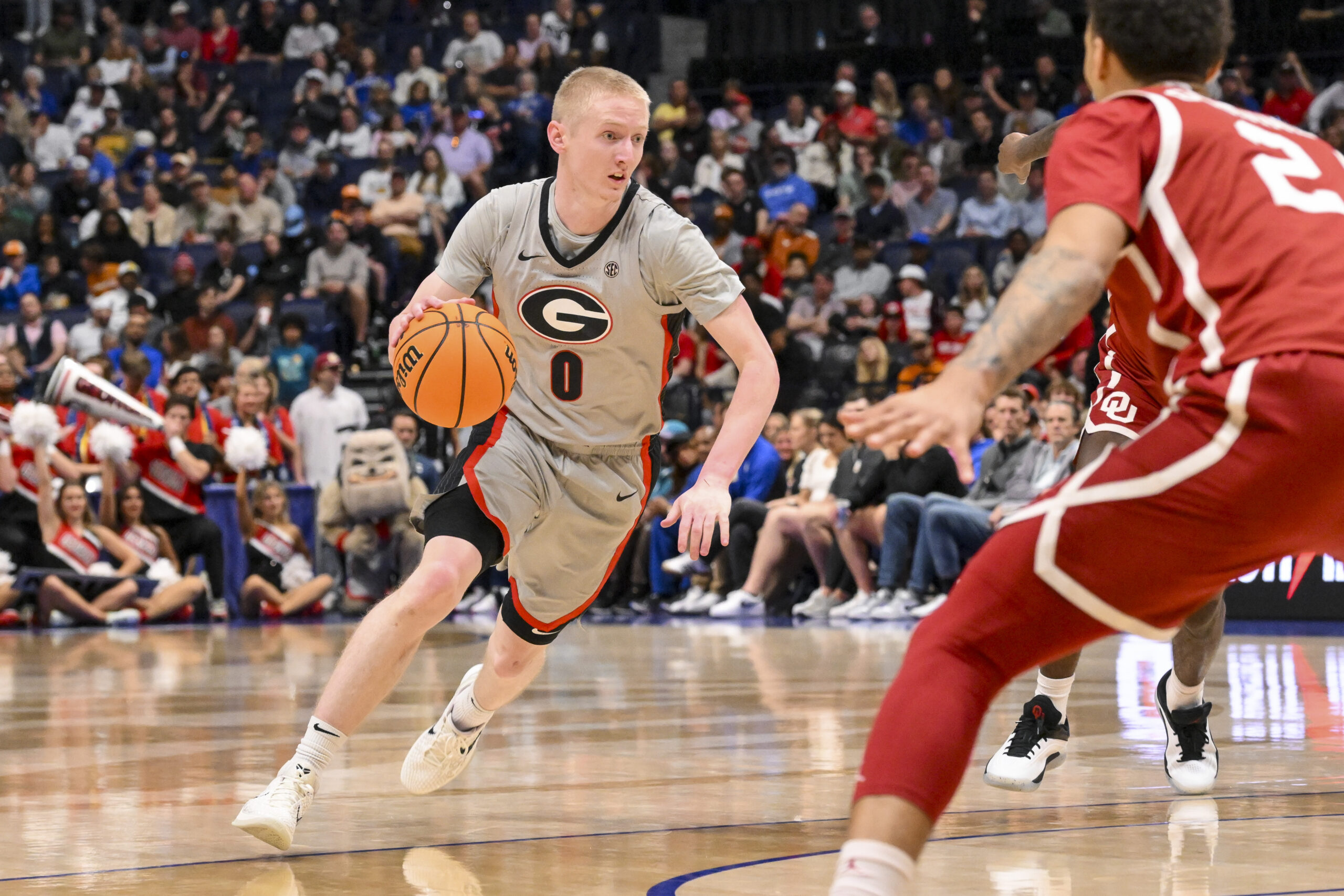 Mar 12, 2025; Nashville, TN, USA;  Georgia Bulldogs guard Blue Cain (0) dribbles the ball against the Oklahoma Sooners during the first half at Bridgestone Arena. Mandatory Credit: Steve Roberts-Imagn Images