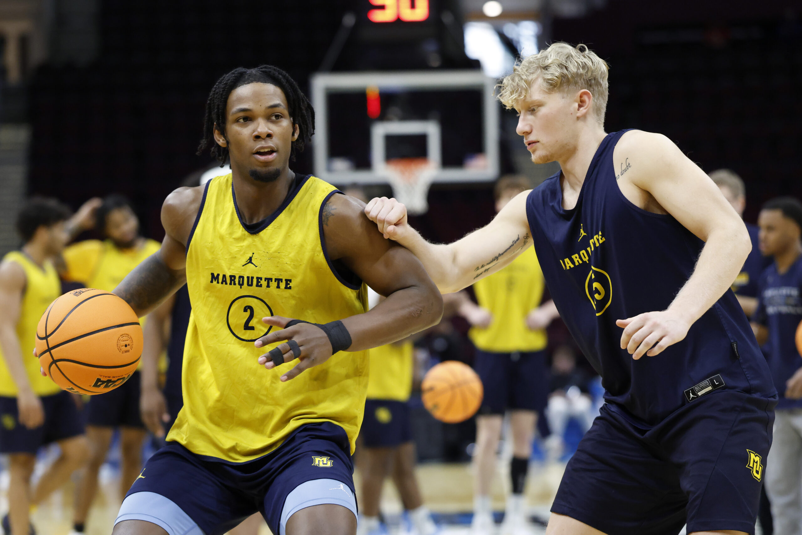 Mar 20, 2025; Cleveland, OH, USA; Marquette Golden Eagles guard Chase Ross (2) and guard Jack Anderson (25) practice during the NCAA Tournament First Round Practice at Rocket Arena. Mandatory Credit: Rick Osentoski-Imagn Images