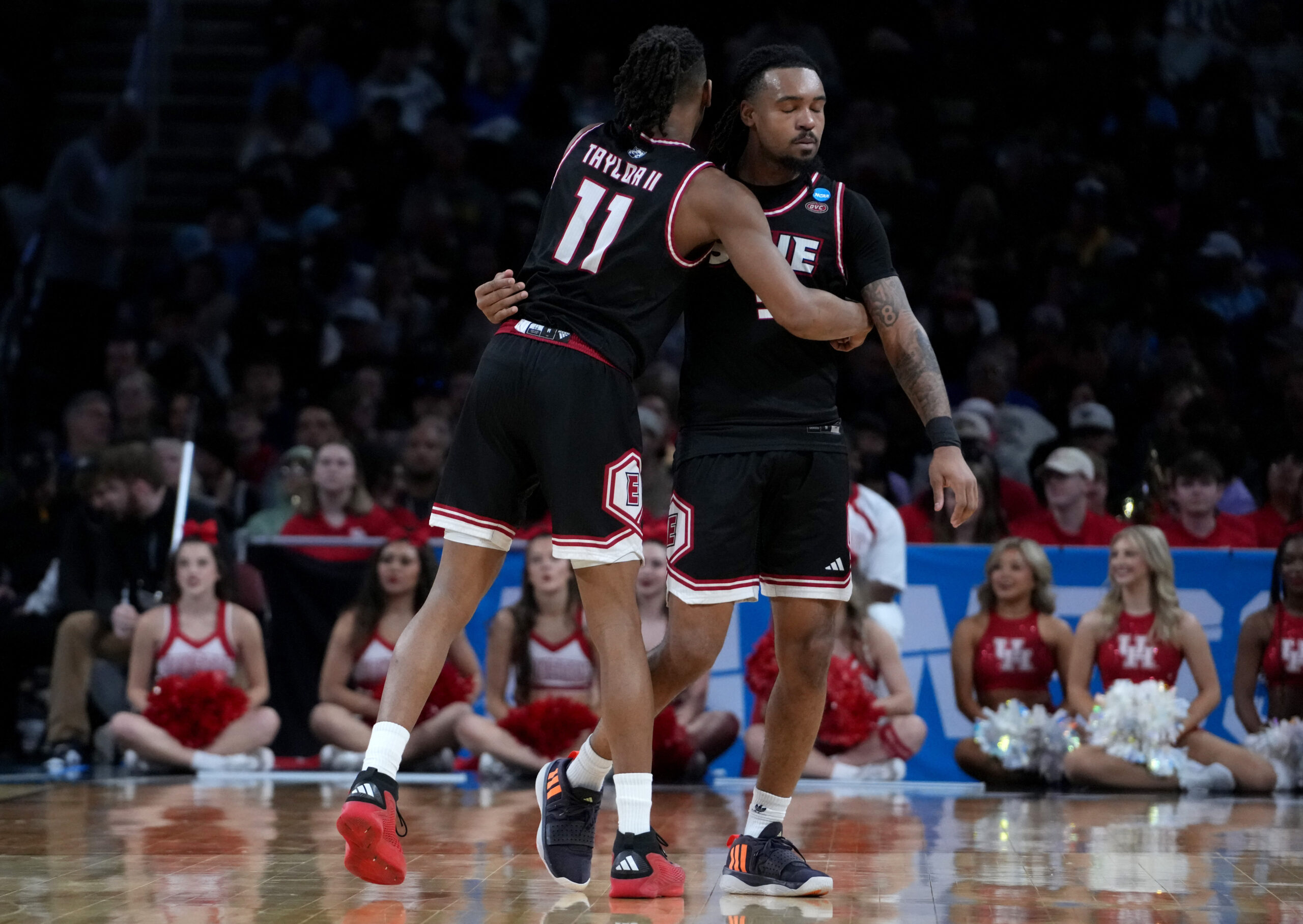Mar 20, 2025; Wichita, KS, USA; SIU Edwardsville Cougars guard Brian Taylor II (11) and guard Ray'Sean Taylor (3) react in the second half of a first round men’s NCAA Tournament game against the Houston Cougars at Intrust Bank Arena. Mandatory Credit: Kirby Lee-Imagn Images