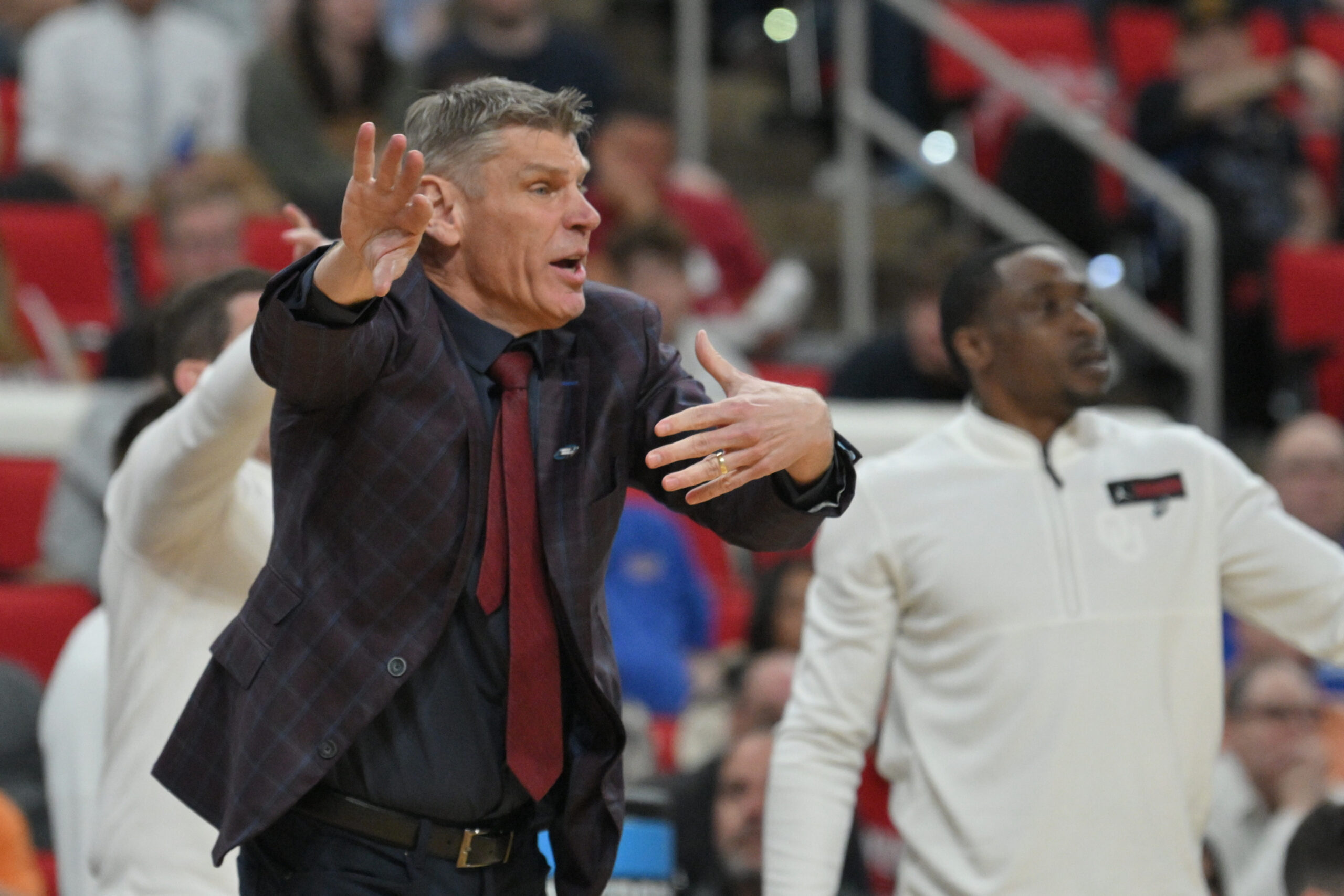 Mar 21, 2025; Raleigh, NC, USA; Oklahoma Sooners head coach Porter Moser reacts during the second half against the Connecticut Huskies at Lenovo Center. Mandatory Credit: Zachary Taft-Imagn Images