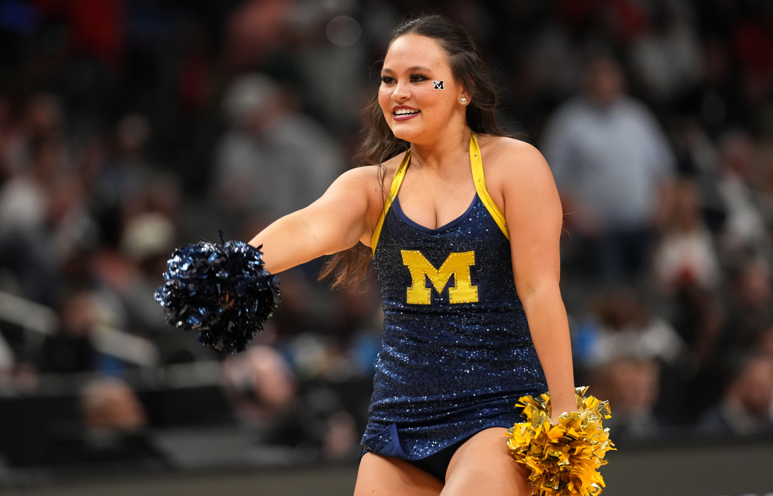 Mar 28, 2025; Atlanta, GA, USA; Michigan Wolverines cheerleaders in the second half of a South Regional semifinal of the 2025 NCAA tournament against the Auburn Tigers at State Farm Arena. Mandatory Credit: Brett Davis-Imagn Images