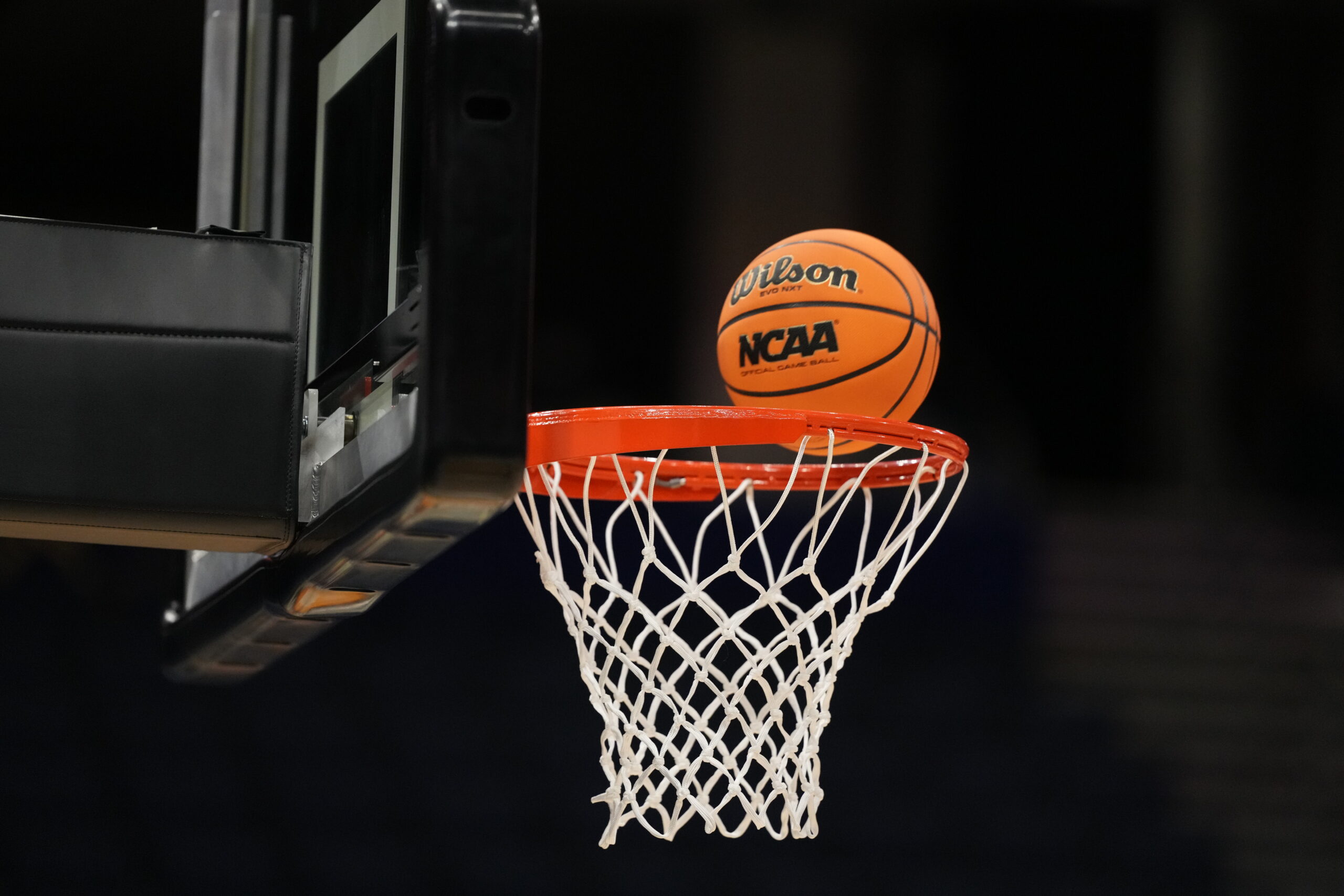 Apr 3, 2025; Tampa, FL, USA; A Wilson EVO Nxt basketball ball with the 2025 NCAA Women's Final Four logo approaches the rim and the net at Amalie Arena. Mandatory Credit: Kirby Lee-Imagn Images