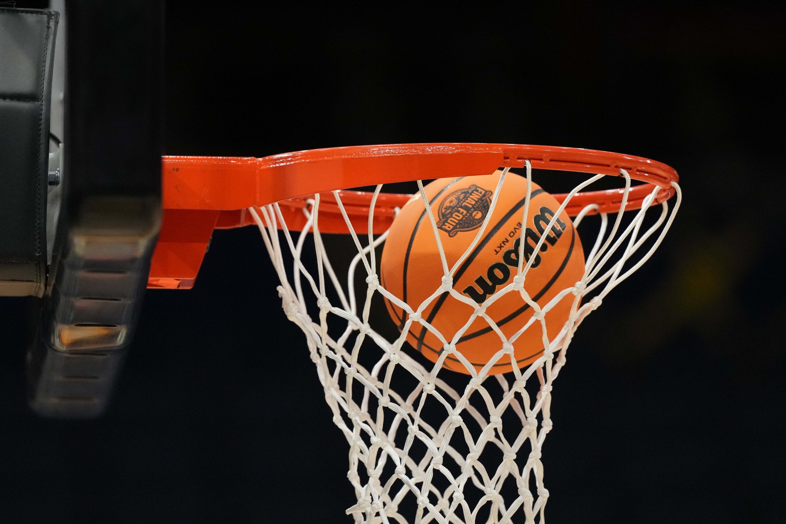 Apr 3, 2025; Tampa, FL, USA; A Wilson EVO Nxt basketball ball with the 2025 NCAA Women's Final Four logo approaches the rim and the net at Amalie Arena. Mandatory Credit: Kirby Lee-Imagn Images