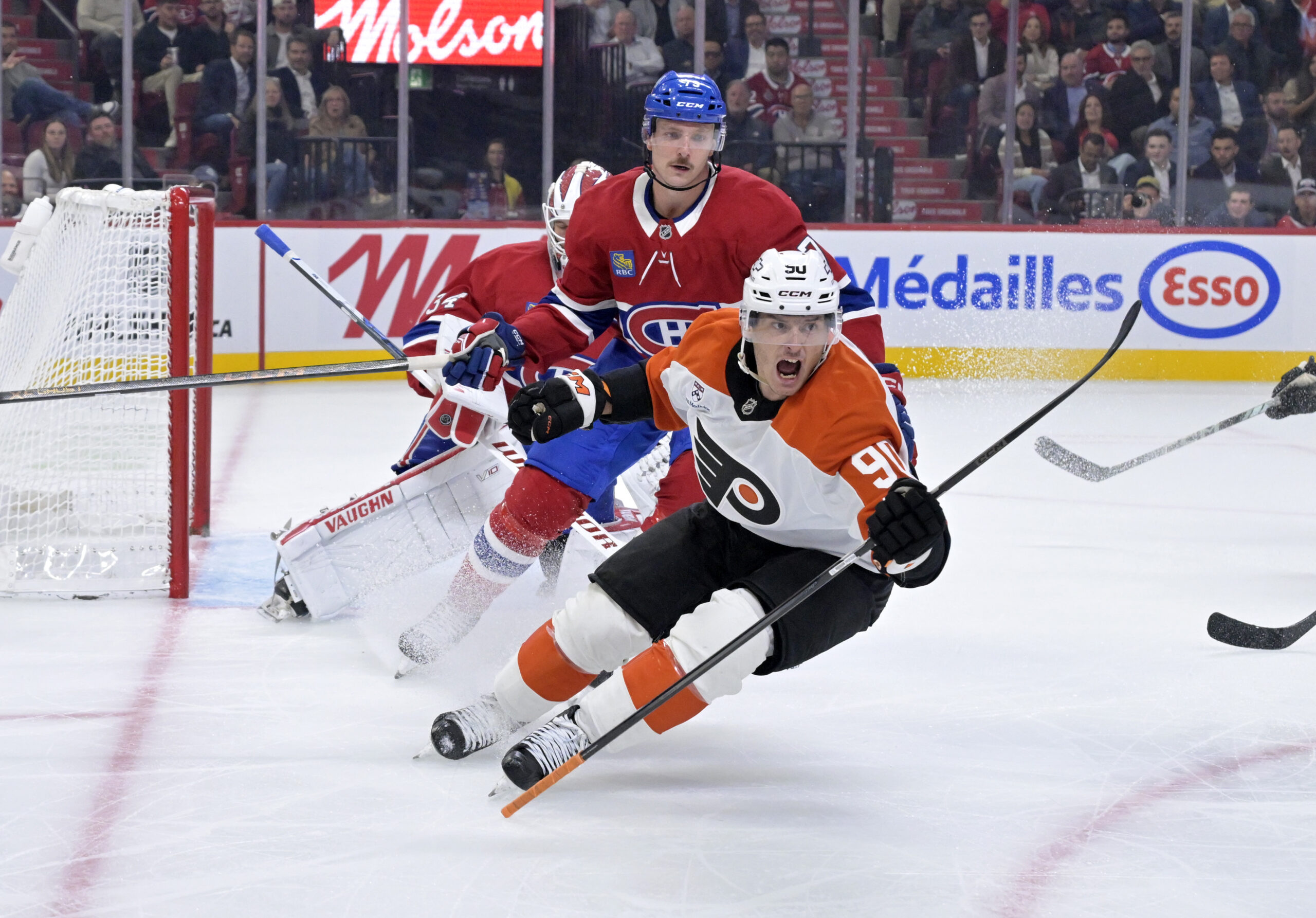 Sep 23, 2025; Montreal, Quebec, CAN; Philadelphia Flyers forward Anthony Richard (90) scores a goal against Montreal Canadiens goalie Kaapo Kahkonen (34) during the second period at the Bell Centre. Mandatory Credit: Eric Bolte-Imagn Images
