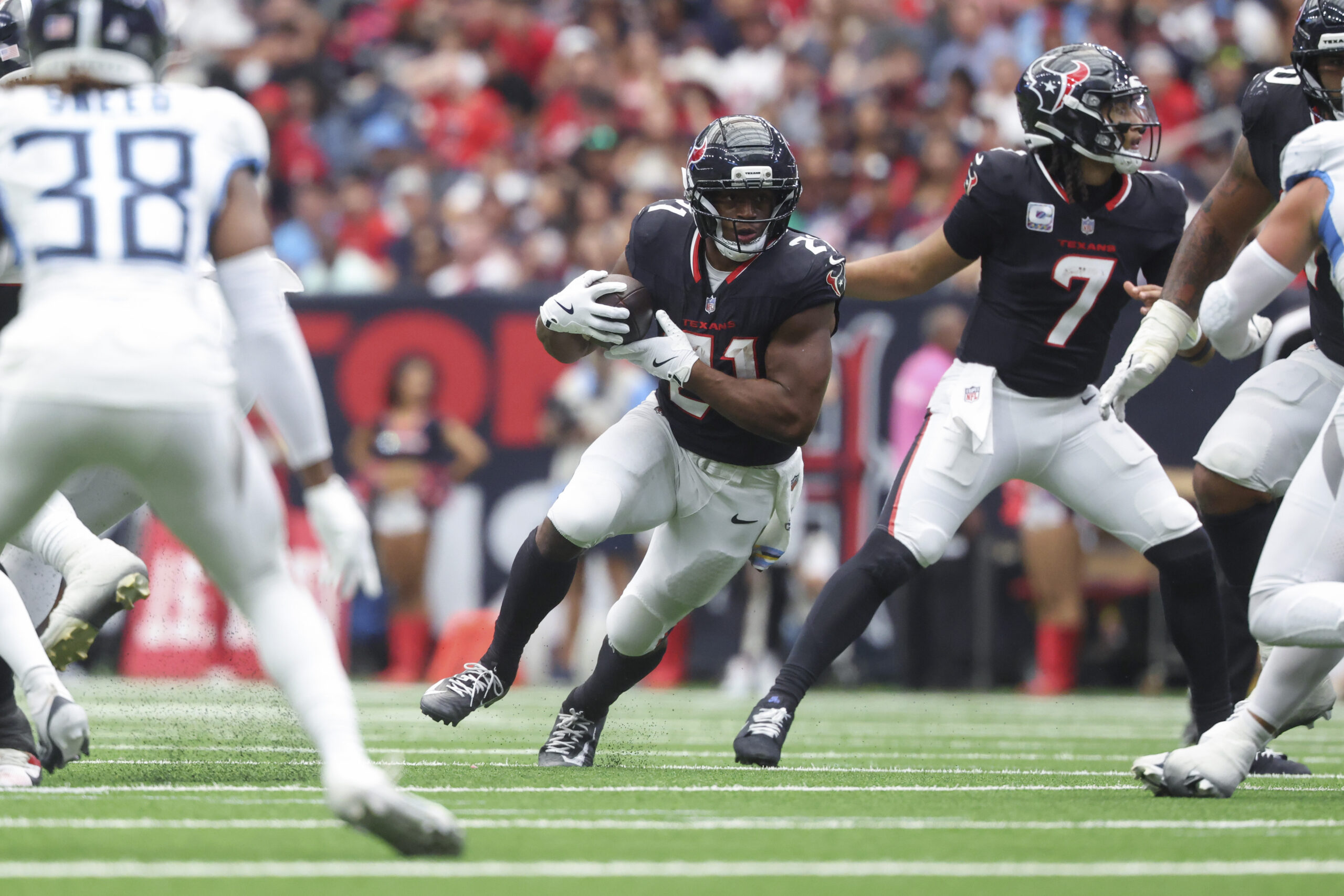 Sep 28, 2025; Houston, Texas, USA; Houston Texans running back Nick Chubb (21) runs with the ball during the fourth quarter against the Tennessee Titans at NRG Stadium. Mandatory Credit: Troy Taormina-Imagn Images