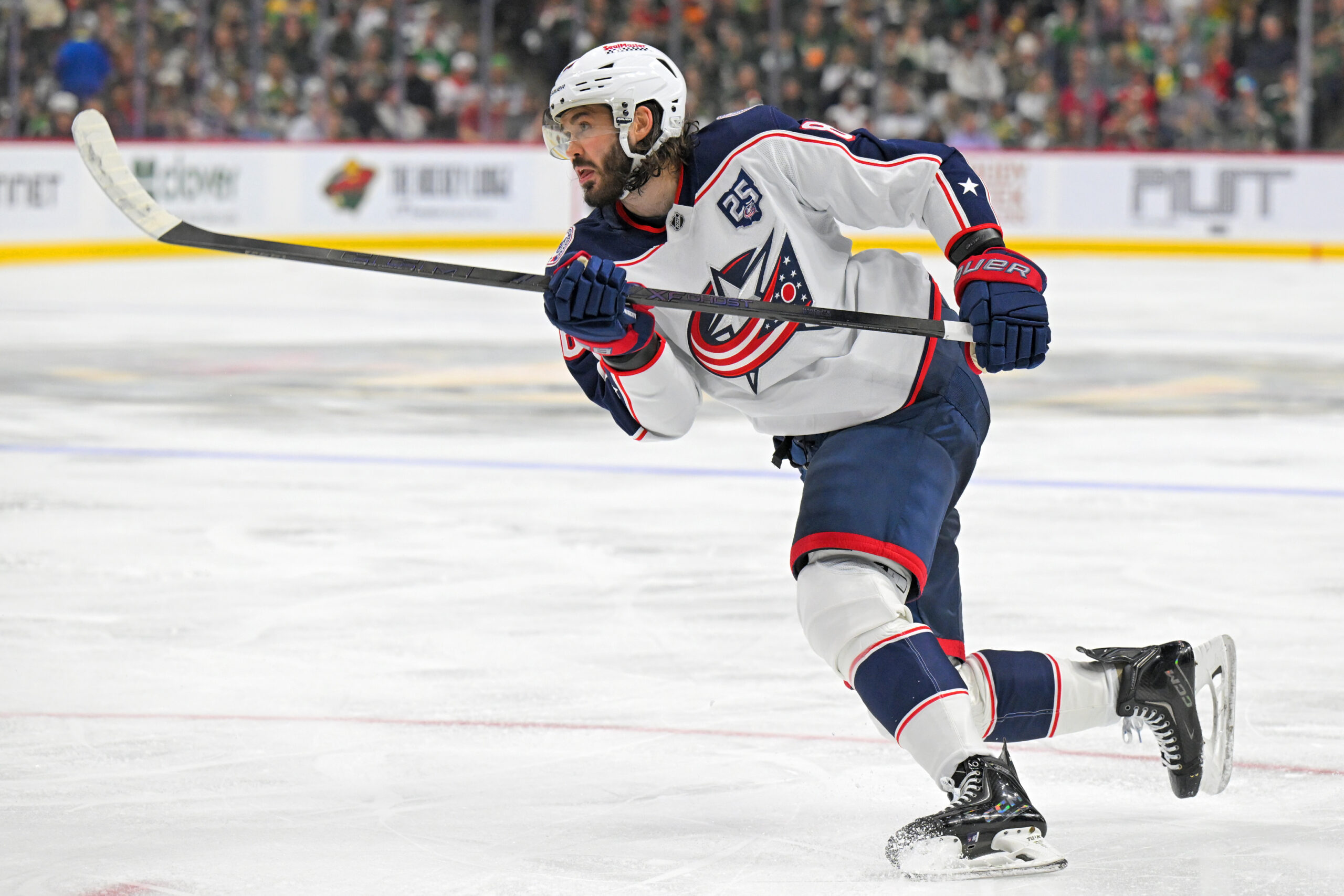 Oct 11, 2025; Saint Paul, Minnesota, USA;  Columbus Blue Jackets forward Kirill Marchenko (86) completes the hat trick against the Minnesota Wild on this power play goal during the third period at Grand Casino Arena. Mandatory Credit: Nick Wosika-Imagn Images