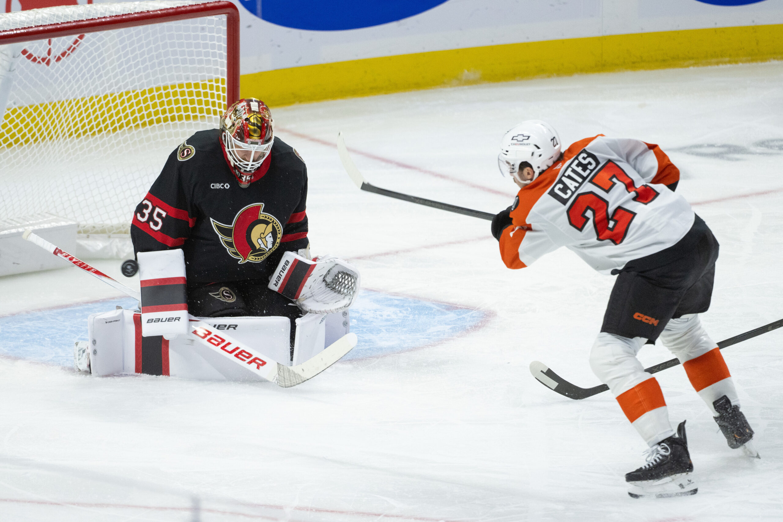 Oct 23, 2025; Ottawa, Ontario, CAN; Ottawa Senators goalie Linus Ullmark (35) makes a save on a shot from Philadelphia Flyers left wing Noah Cates (27) in the third period at the Canadian Tire Centre. Mandatory Credit: Marc DesRosiers-IMAGN Images