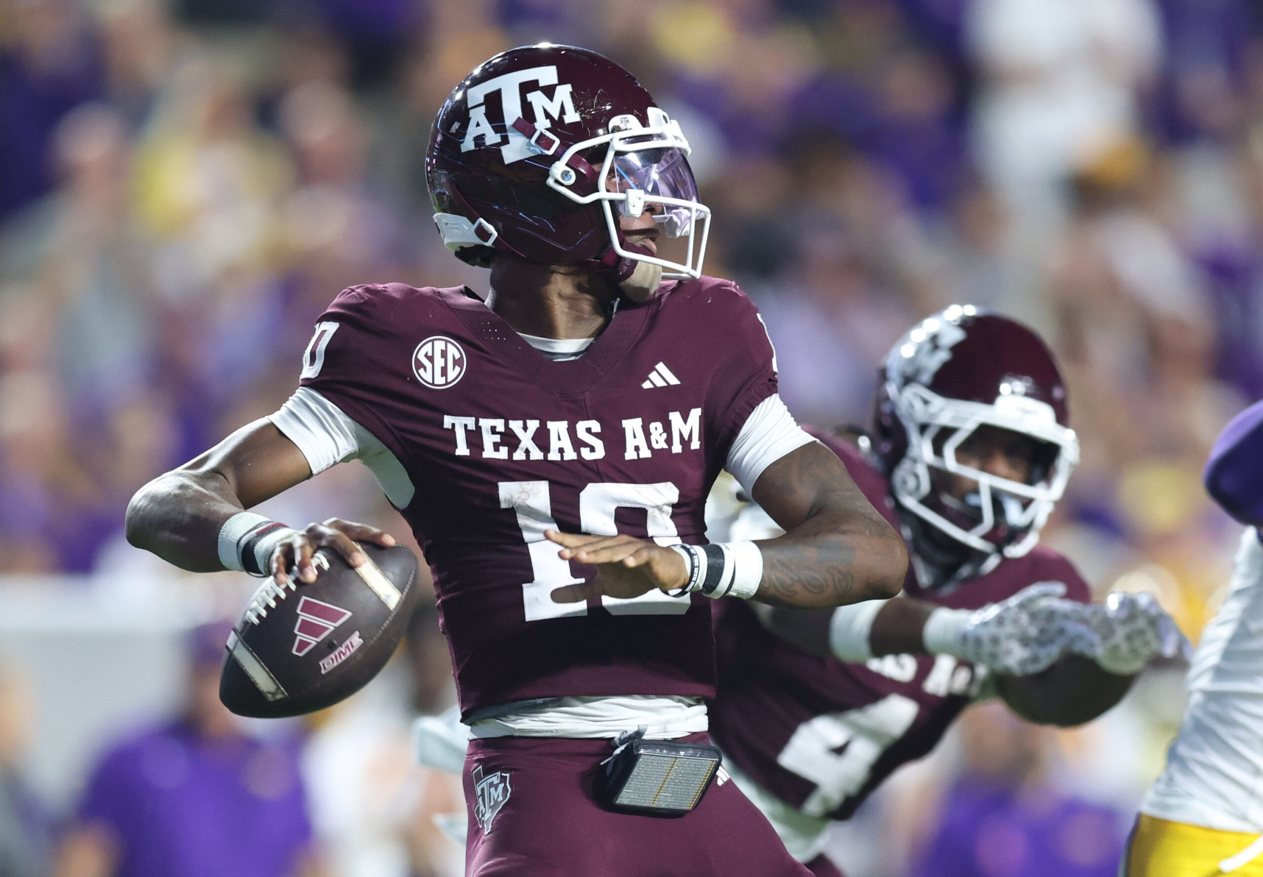 Oct 25, 2025; Baton Rouge, Louisiana, USA; Texas A&M Aggies quarterback Marcel Reed (10) drops to throw during the first half against the Louisiana State Tigers at Tiger Stadium. Mandatory Credit: Stephen Lew-Imagn Images