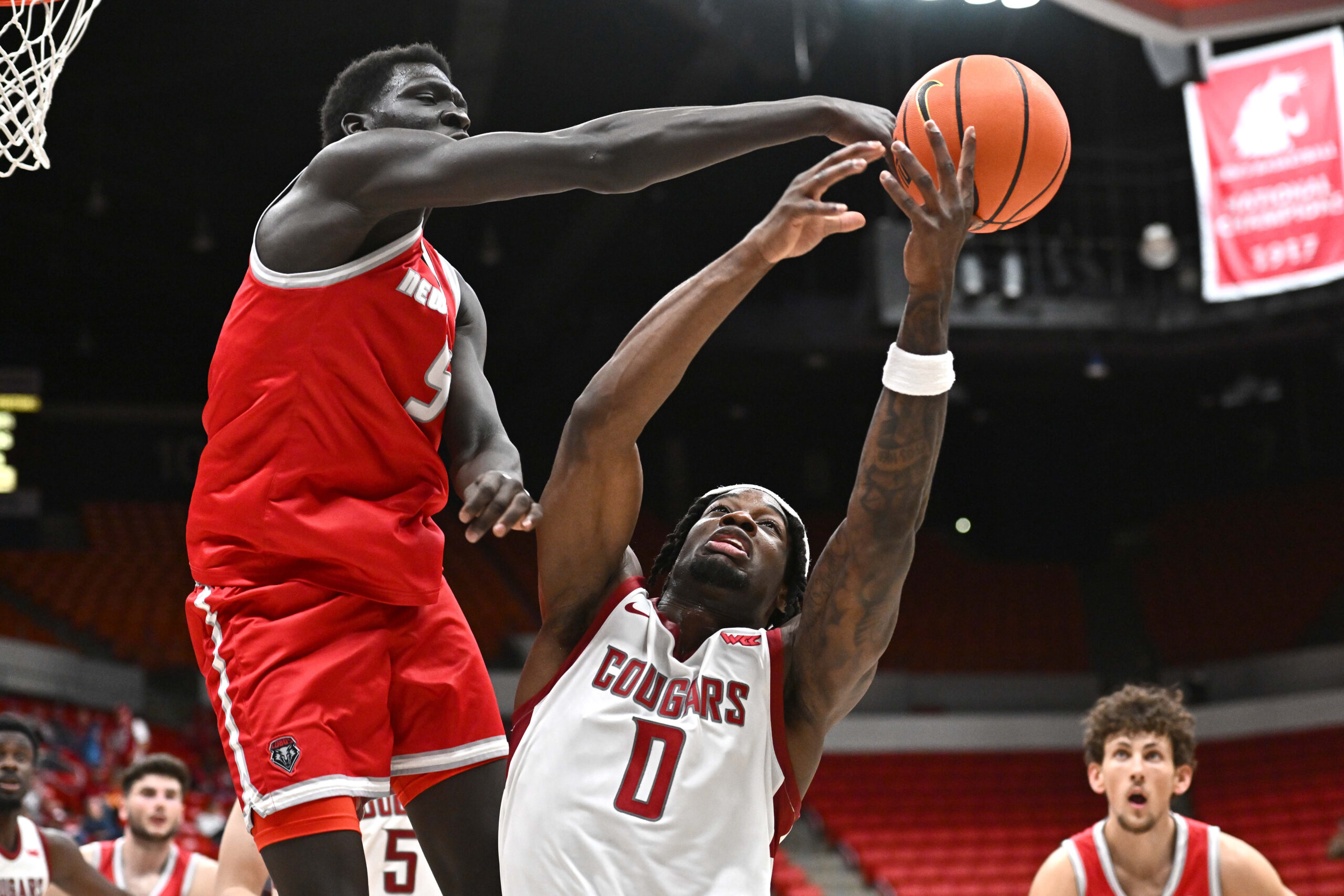 Oct 25, 2025; Pullman, WA, USA; New Mexico Lobos forward Antonio Chol (5) fights for the rebound against Washington State Cougars forward Emmanuel Ugbo (0) in the second half at Friel Court at Beasley Coliseum.  Mandatory Credit: James Snook-Imagn Images