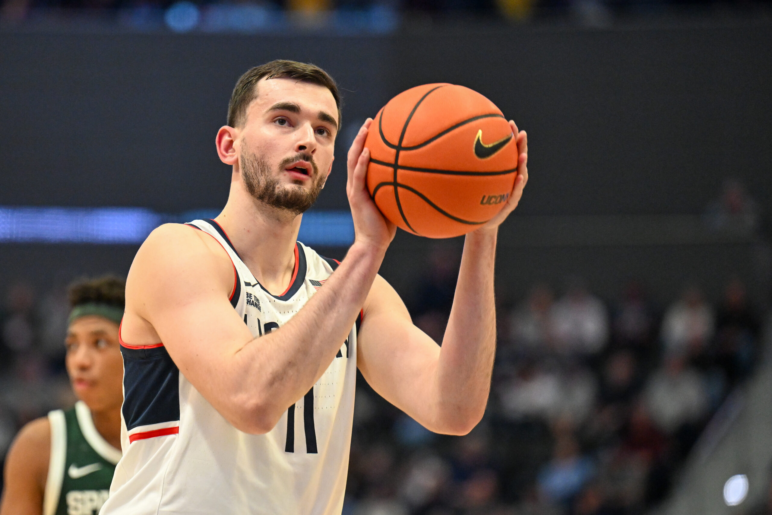 Oct 28, 2025; Hartford, CT, USA; Connecticut Huskies forward Alex Karaban (11) shoot a free throw during the first half against the Michigan State Spartans at PeoplesBank Arena. Mandatory Credit: Mark Smith-Imagn Images