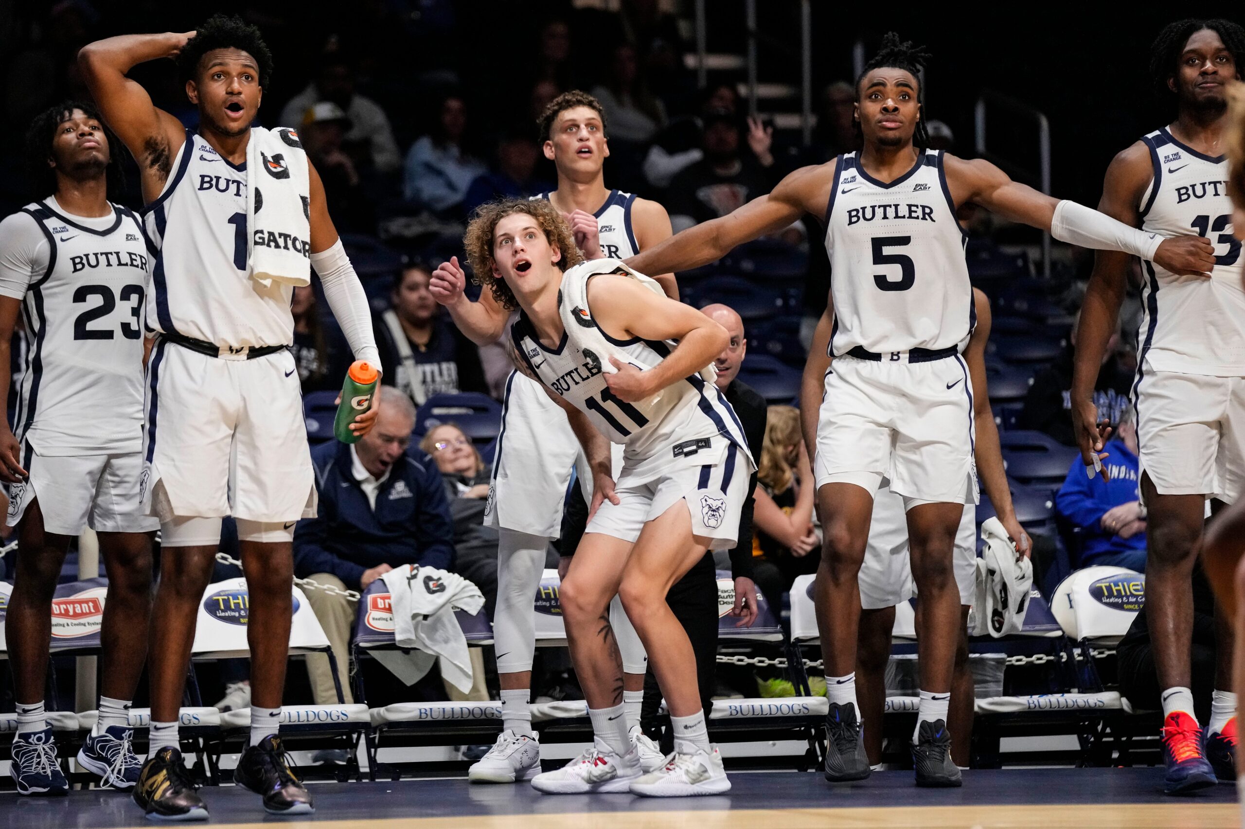 Butler Bulldogs guard Evan Haywood (1), Butler Bulldogs guard Finley Bizjack (11) and Butler Bulldogs forward Michael Ajayi (5) watch from the sidelines on Wednesday, Oct. 29, 2025, during the game at Hinkle Fieldhouse in Indianapolis. The Butler Bulldogs defeated the Indiana State Sycamores, 105-80.