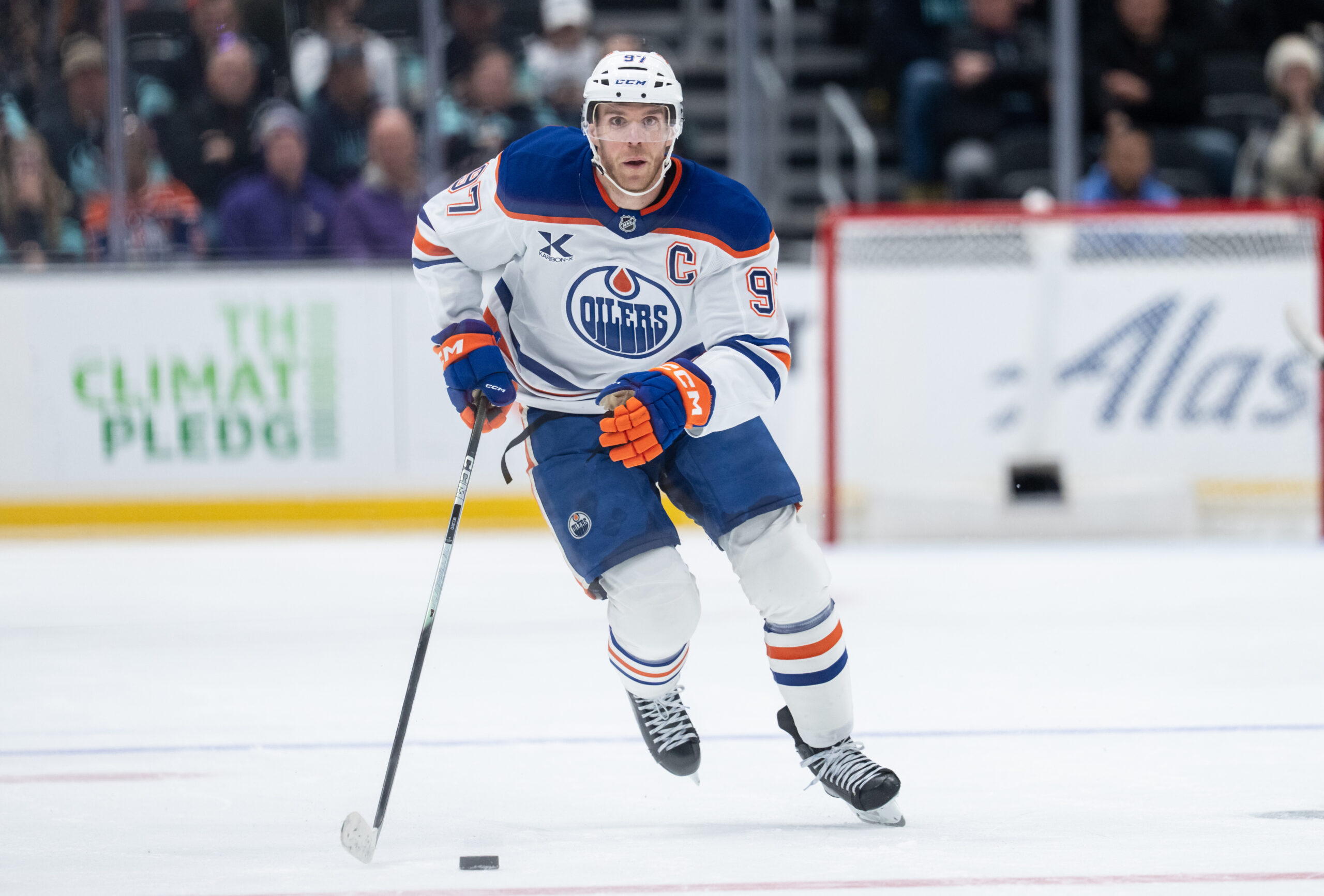 Oct 25, 2025; Seattle, Washington, USA; Edmonton Oilers forward Connor McDavid (97) skates with the puck against the Seattle Kraken at Climate Pledge Arena. Mandatory Credit: Stephen Brashear-Imagn Images