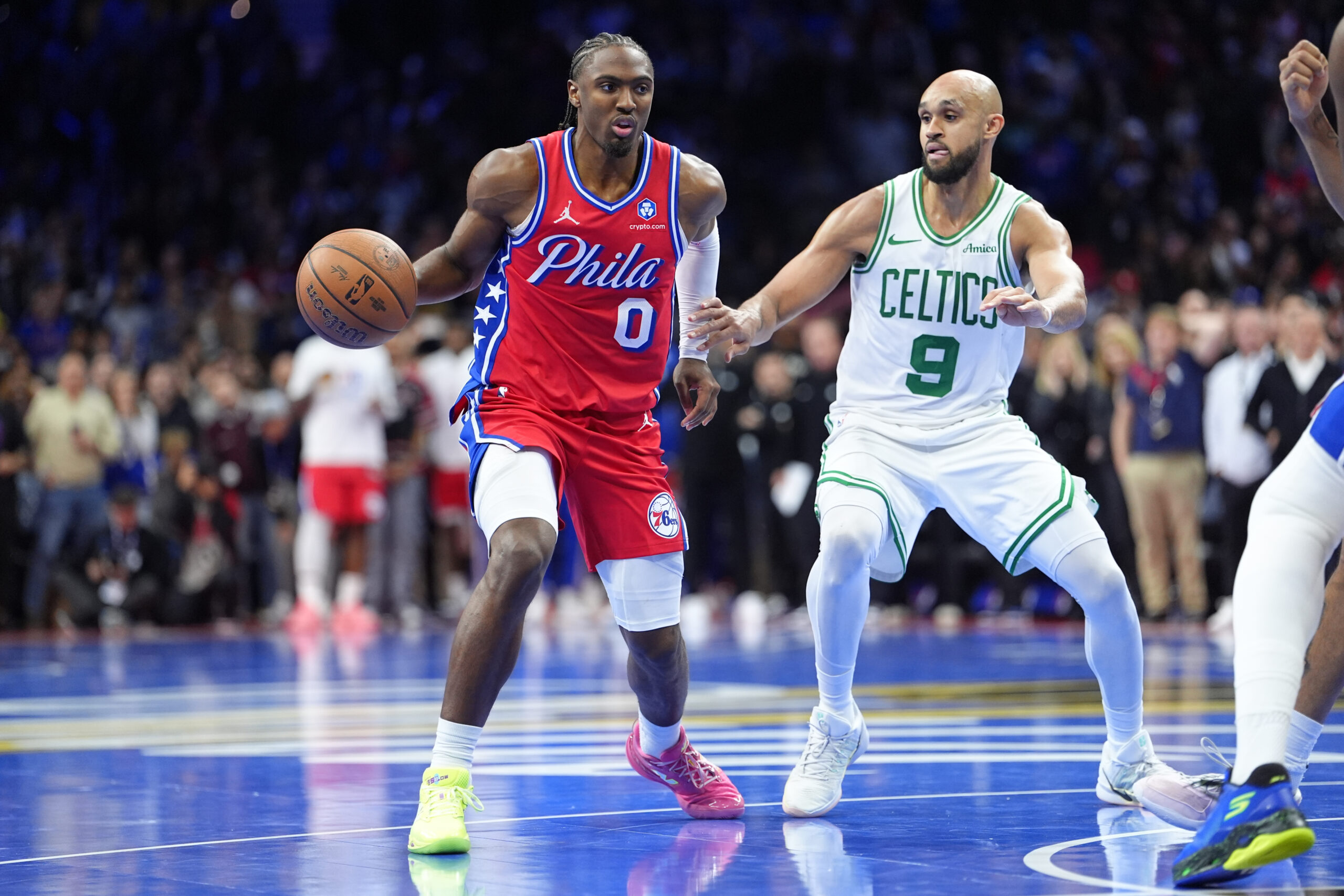 Oct 31, 2025; Philadelphia, Pennsylvania, USA; Philadelphia 76ers guard Tyrese Maxey (0) drives against Boston Celtics guard Derrick White (9) in the fourth quarter at Xfinity Mobile Arena. Mandatory Credit: Kyle Ross-Imagn Images