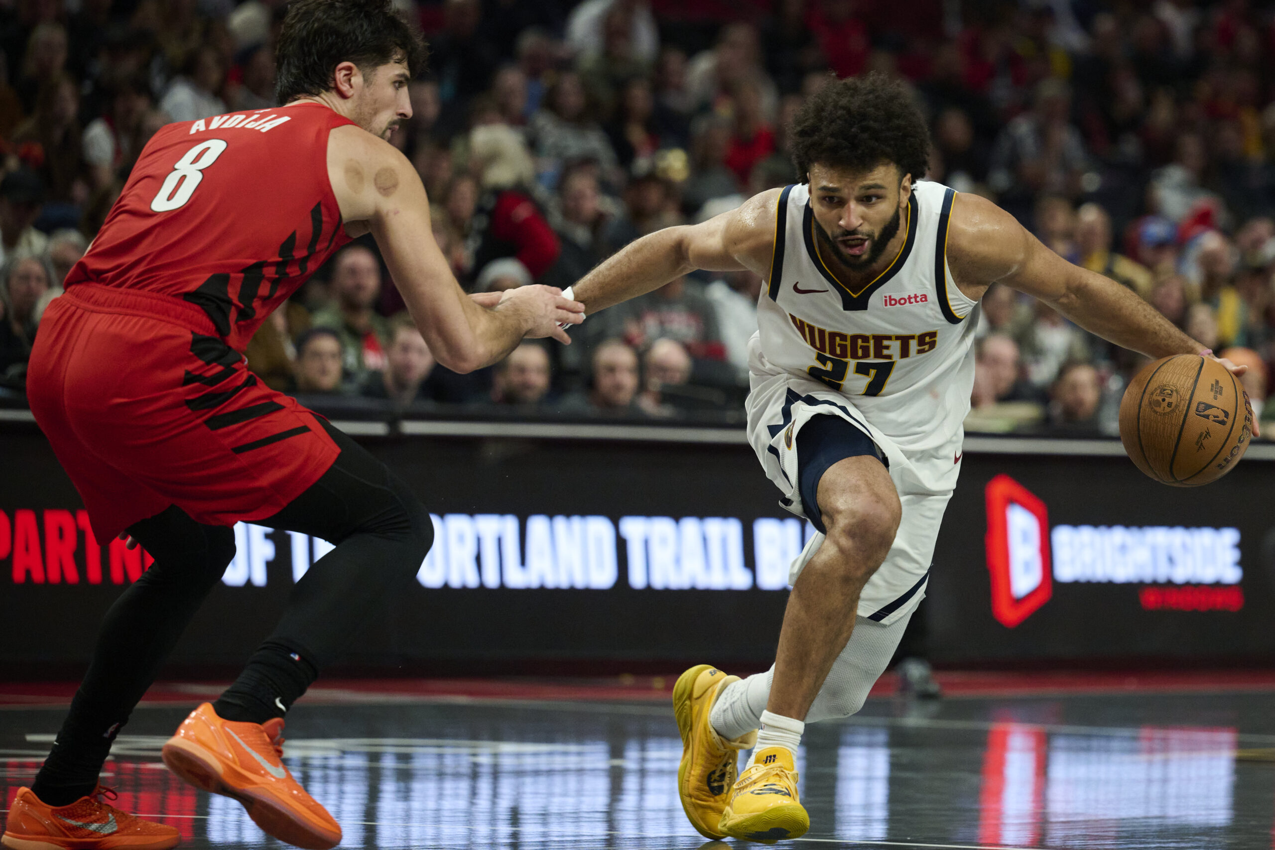 Oct 31, 2025; Portland, Oregon, USA; Denver Nuggets guard Jamal Murray (27) dribbles the ball during the second half against Portland Trail Blazers forward Deni Avdija (8) at Moda Center. Mandatory Credit: Troy Wayrynen-Imagn Images