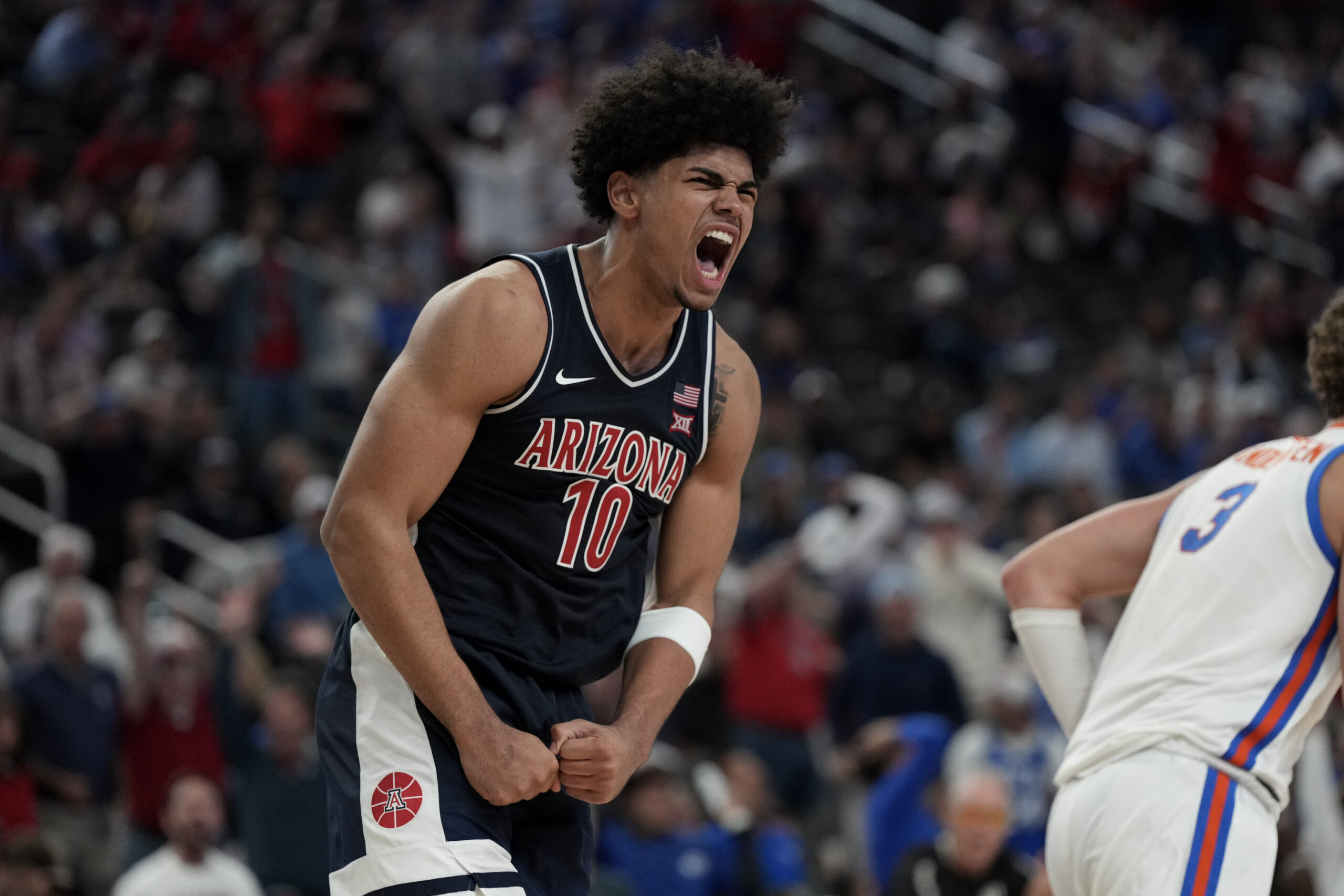 Nov 3, 2025; Las Vegas, NV, USA; Arizona Wildcats forward Koa Peat (10) celebrates a play against the Florida Gators in the second half of the Hall of Fame Series game at T-Mobile Arena. Mandatory Credit: Candice Ward-Imagn Images