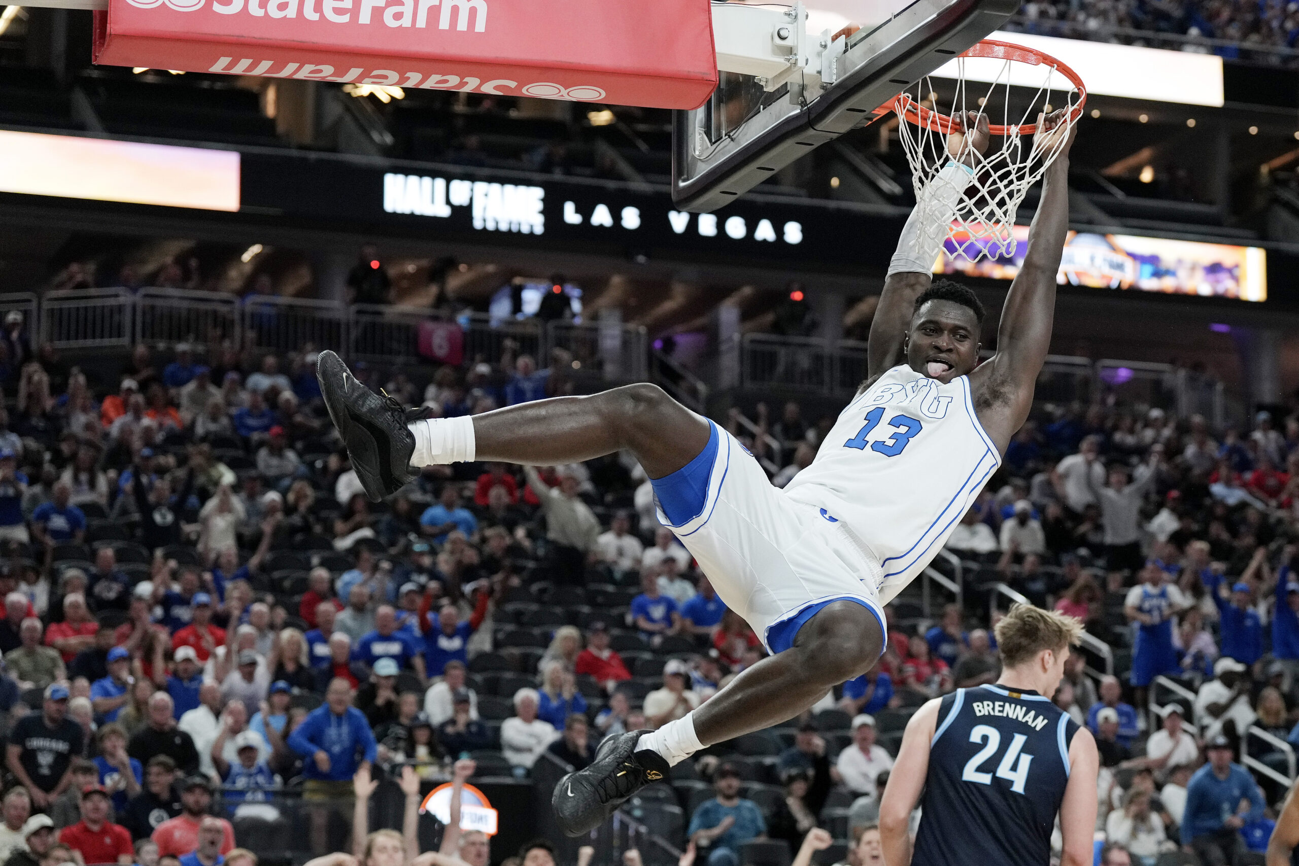 Nov 3, 2025; Las Vegas, Nevada, USA; BYU Cougars center Keba Keita (13) dunks against the Villanova Wildcats  during the first half of the Hall of Fame Series game at T-Mobile Arena. Mandatory Credit: Candice Ward-Imagn Images