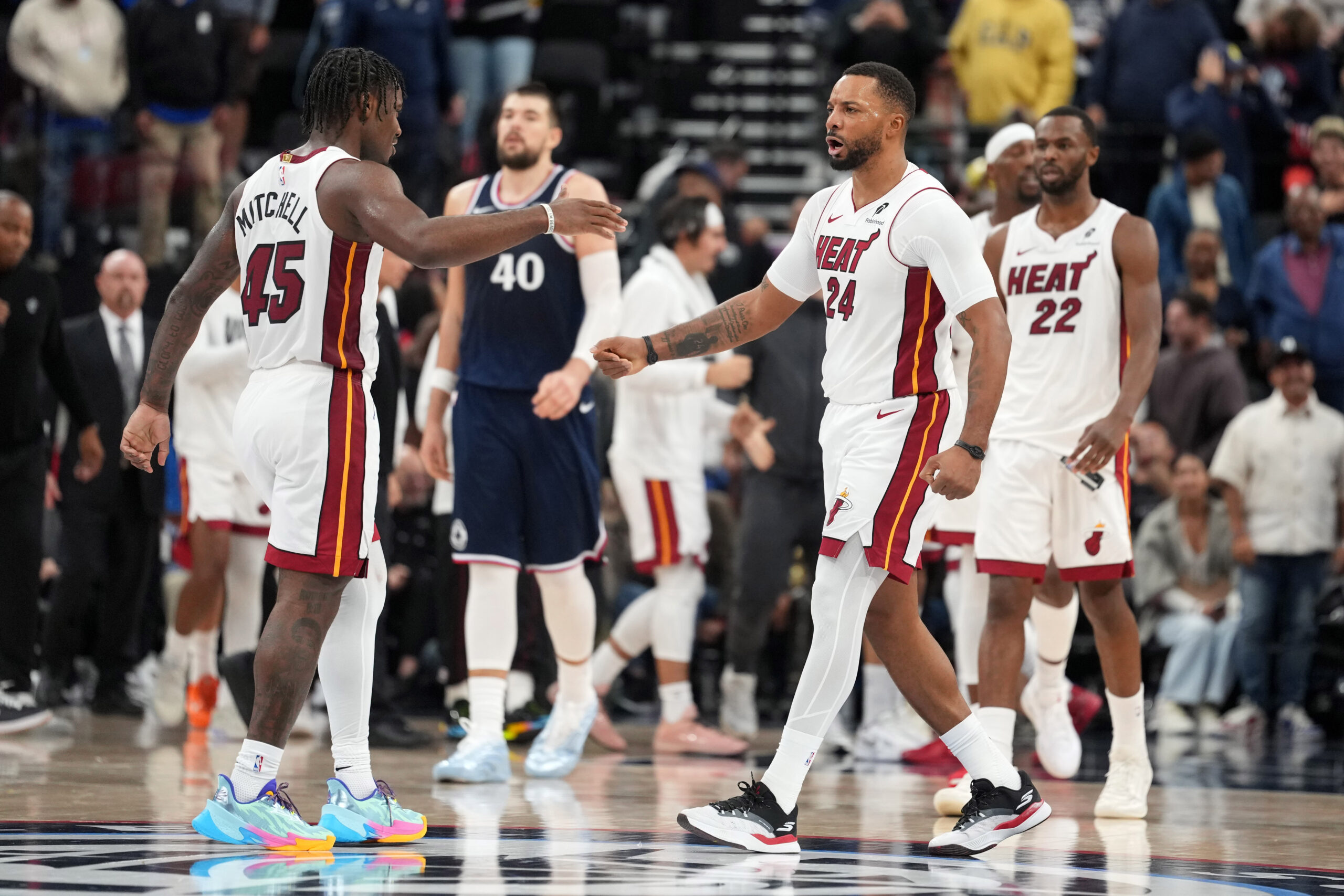 Nov 3, 2025; Inglewood, California, USA; Miami Heat guard Norman Powell (24) celebrates with guard Davion Mitchell (45) at the end of the game against the LA Clippers at Intuit Dome. Mandatory Credit: Kirby Lee-Imagn Images