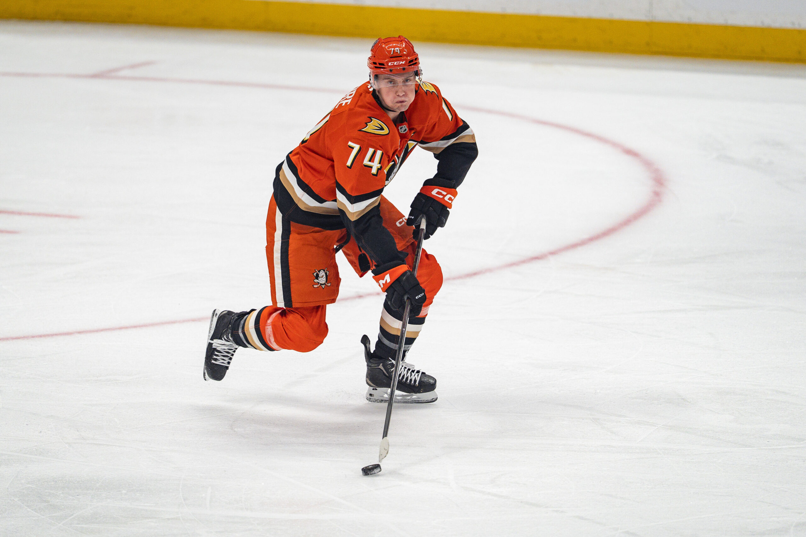 Nov 2, 2025; Anaheim, California, USA; Anaheim Ducks defenseman Ian Moore (74) skates with the puck during the first period at Honda Center. Mandatory Credit: Corinne Votaw-Imagn Images