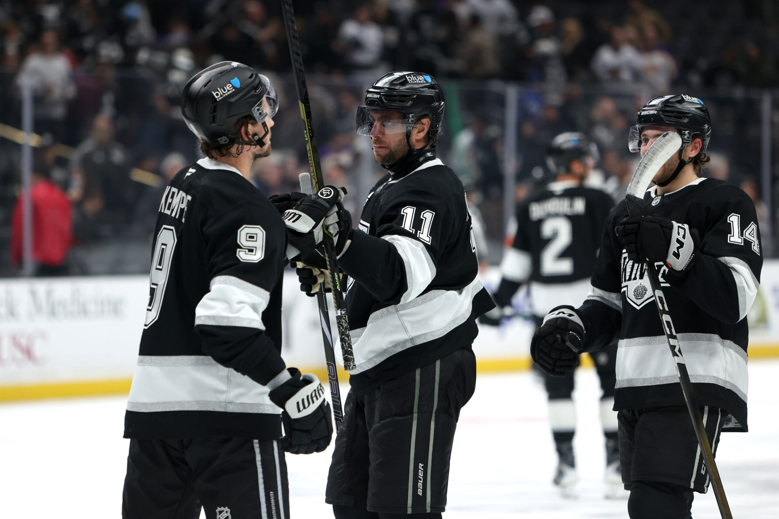 Nov 4, 2025; Los Angeles, California, USA;  Los Angeles Kings center Anze Kopitar (11) celebrates a win with right wing Adrian Kempe (9) after defeating the Winnipeg Jets 3-0 at Crypto.com Arena. Mandatory Credit: Kiyoshi Mio-Imagn Images