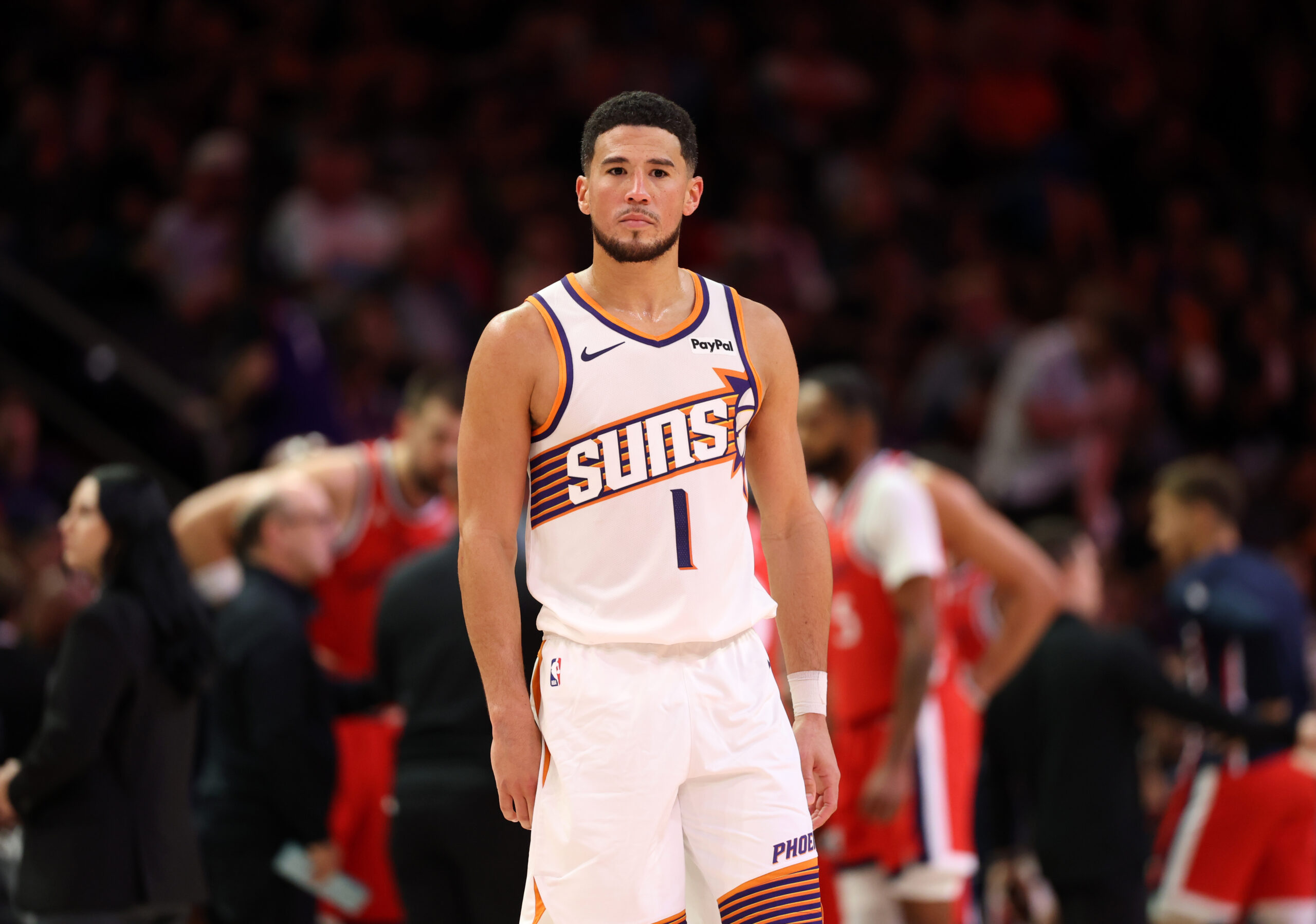 Nov 6, 2025; Phoenix, Arizona, USA; Phoenix Suns guard Devin Booker (1) against the Los Angeles Clippers in the second half at the Mortgage Matchup Center. Mandatory Credit: Mark J. Rebilas-Imagn Images