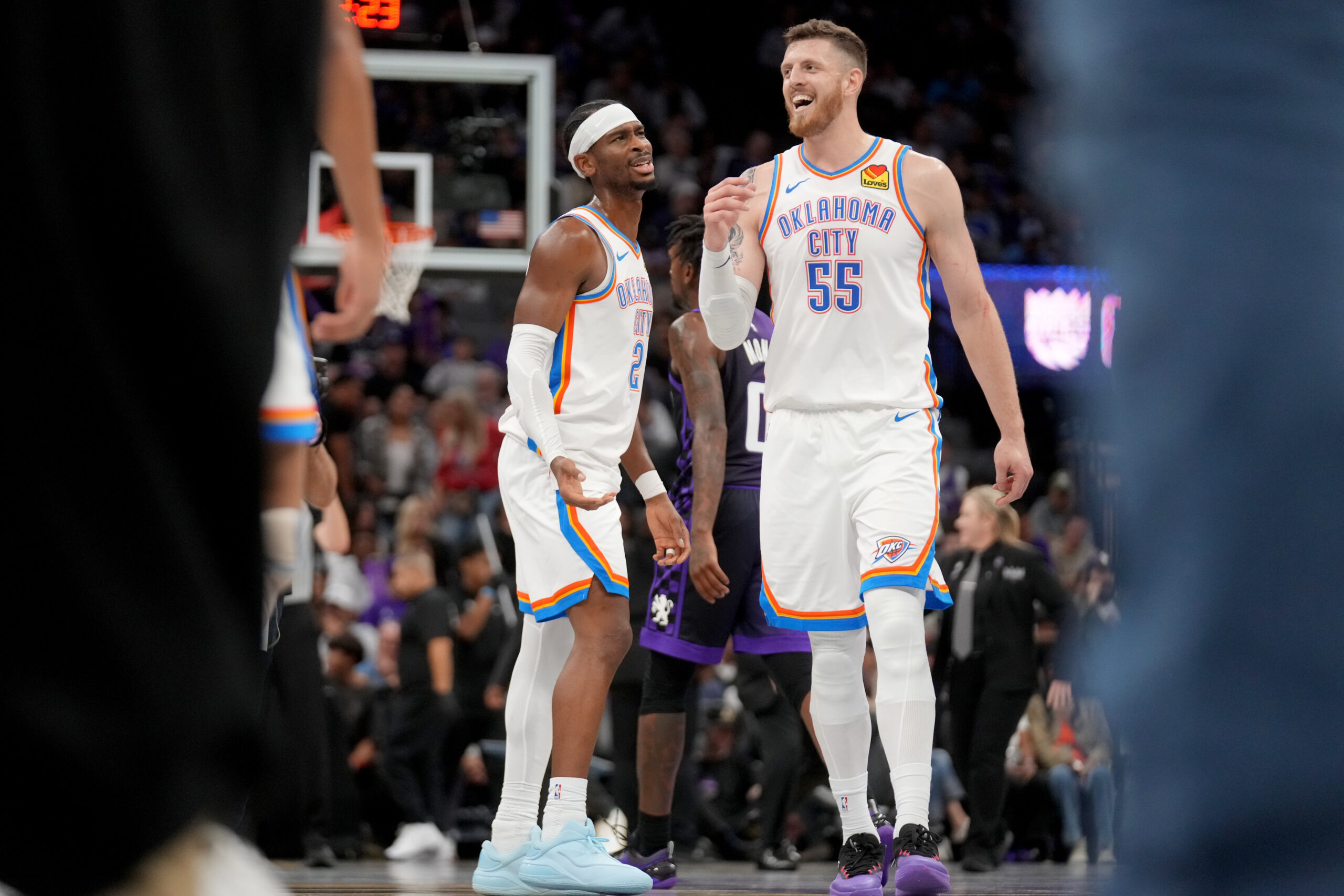 Nov 7, 2025; Sacramento, California, USA; Oklahoma City Thunder guard Shai Gilgeous-Alexander (2) meets with center Isiah Hartenstein (55) after a play against the Sacramento Kings in the third quarter at the Golden 1 Center. Mandatory Credit: Cary Edmondson-Imagn Images
