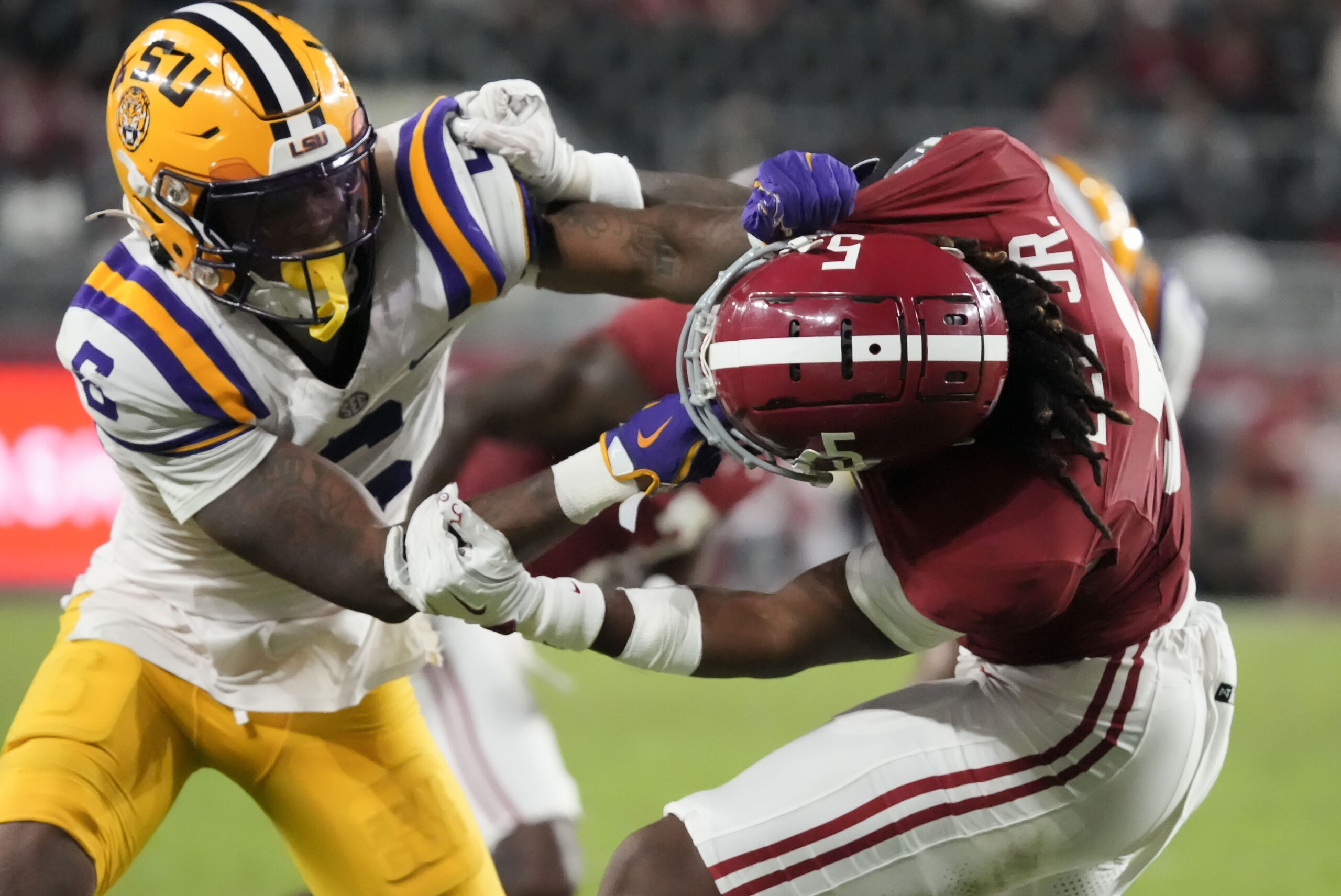 Nov 8, 2025; Tuscaloosa, Alabama, USA;  LSU wide receiver Barion Brown (6) blocks Alabama defensive back Dijon Lee Jr. (5) at Saban Field at Bryant-Denny Stadium. Alabama defeated LSU 20-9. Mandatory Credit: Gary Cosby Jr.-Imagn Images