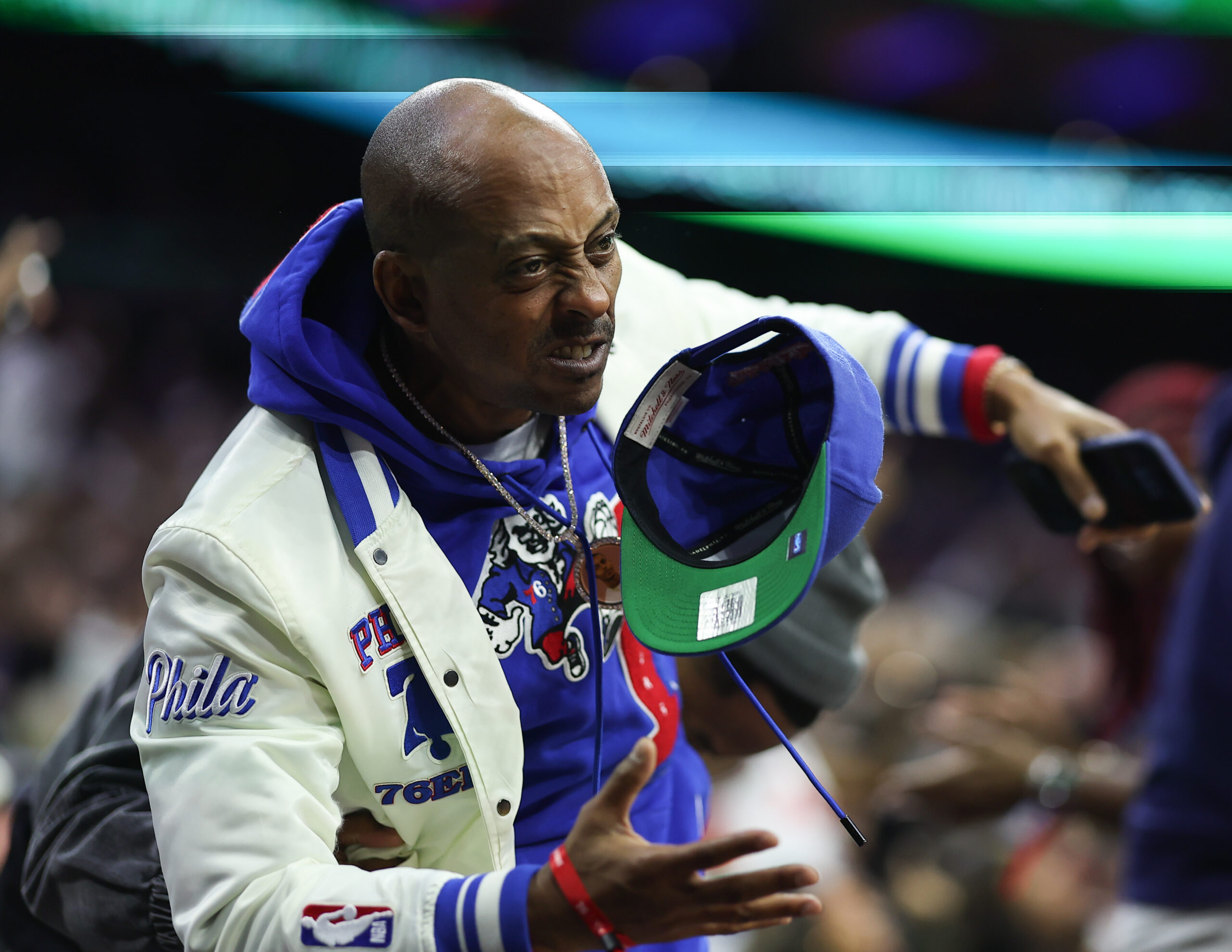Nov 9, 2025; Philadelphia, Pennsylvania, USA; Podcaster and entertainer Gillie Da King reacts after a Philadelphia 76ers score against the Detroit Pistons during the fourth quarter at Xfinity Mobile Arena. Mandatory Credit: Bill Streicher-Imagn Images