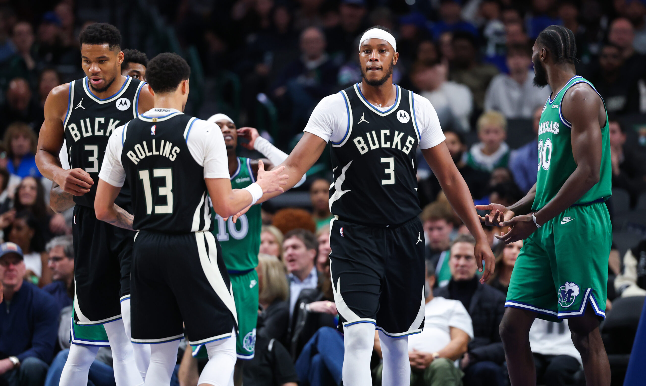 Nov 10, 2025; Dallas, Texas, USA;  Milwaukee Bucks center Myles Turner (3) celebrates with Milwaukee Bucks guard Ryan Rollins (13) during the third quarter against the Dallas Mavericks at American Airlines Center. Mandatory Credit: Kevin Jairaj-Imagn Images